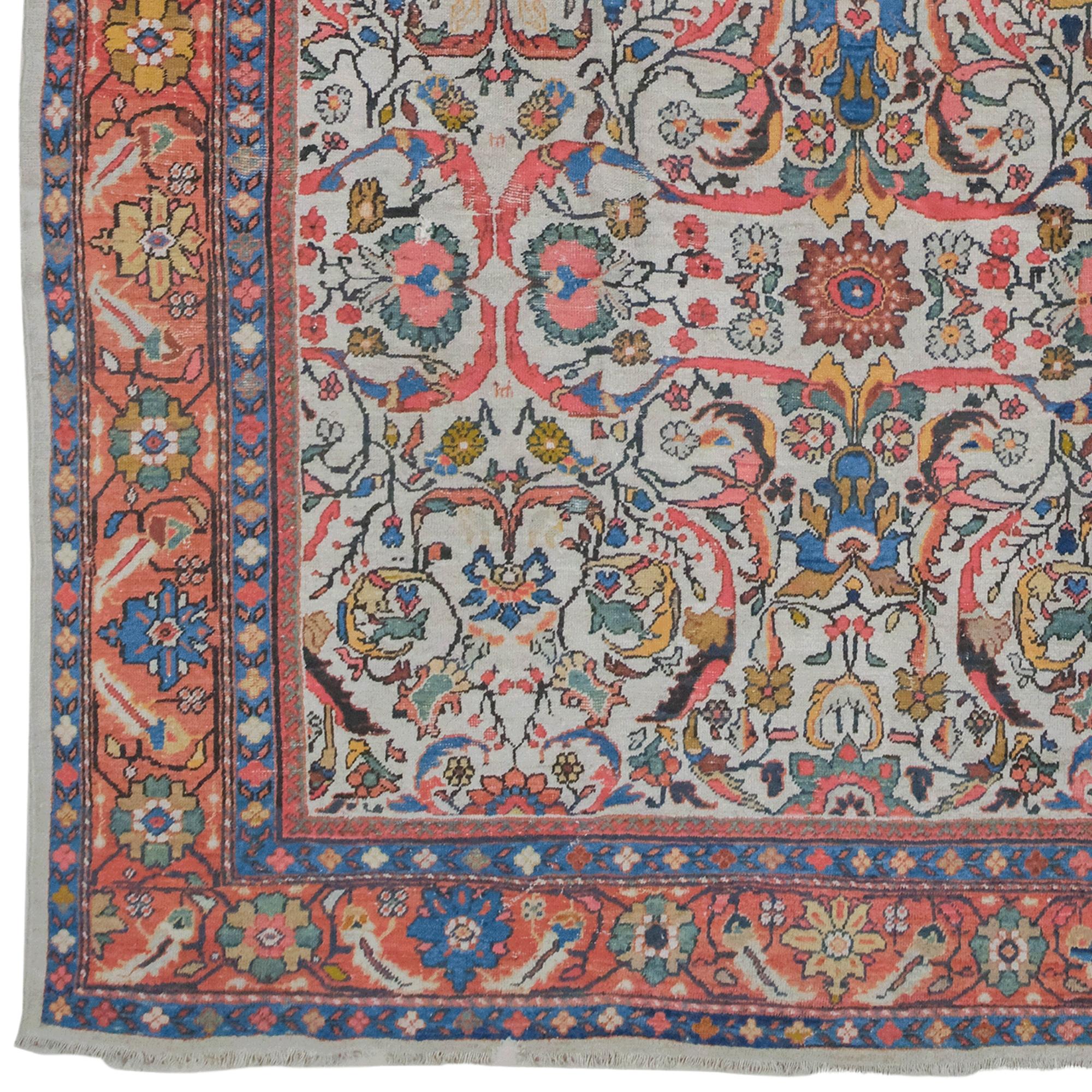 This late 19th century antique Mahal carpet is a unique work of art that reflects the aesthetics of the period with its elegant design and fine craftsmanship. Meticulously woven in the famous Mahal region of Iran, this carpet bears a harmonious