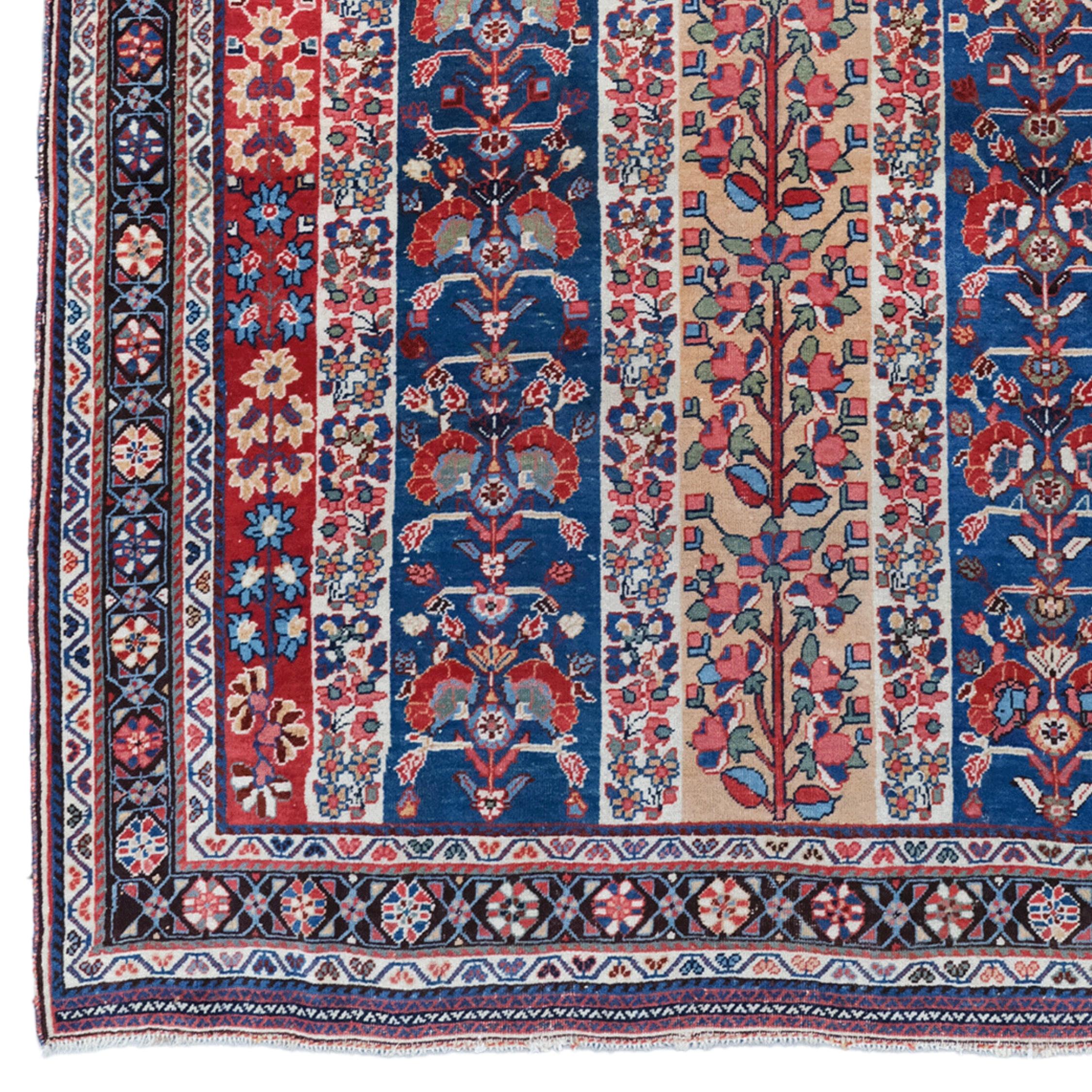 This Antique Qashqai Rug from the late 19th century brings traditional Persian weaving heritage into your home. Woven with fine workmanship, this handmade carpet has a rich color palette with deep red and blue tones. Geometric patterns and details