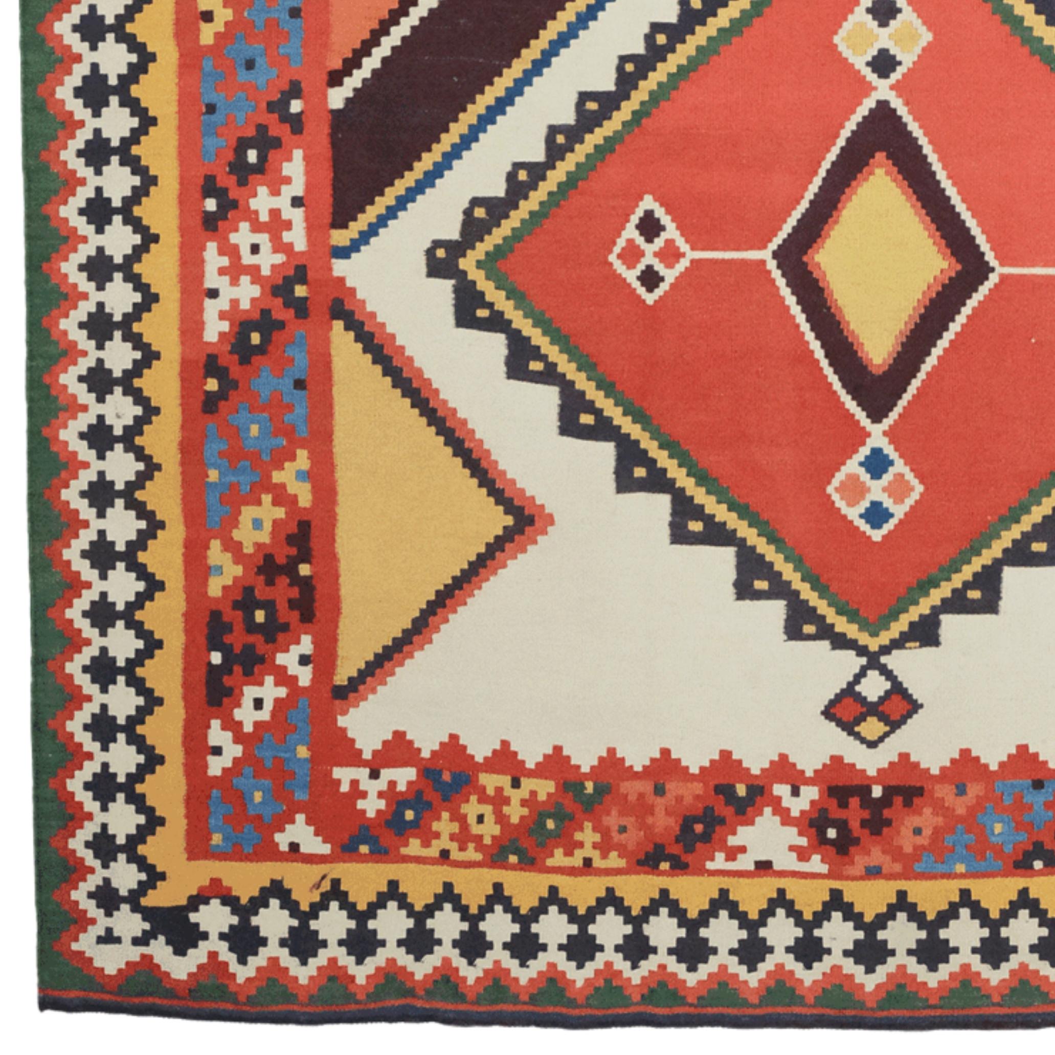 This impressive Qashqai carpet is a rare masterpiece of handicraft, woven by the nomadic Qashqai people of southwestern Iran in the late 19th century. The large diamond-shaped motifs and surrounding geometric patterns offer both symbolic and visual