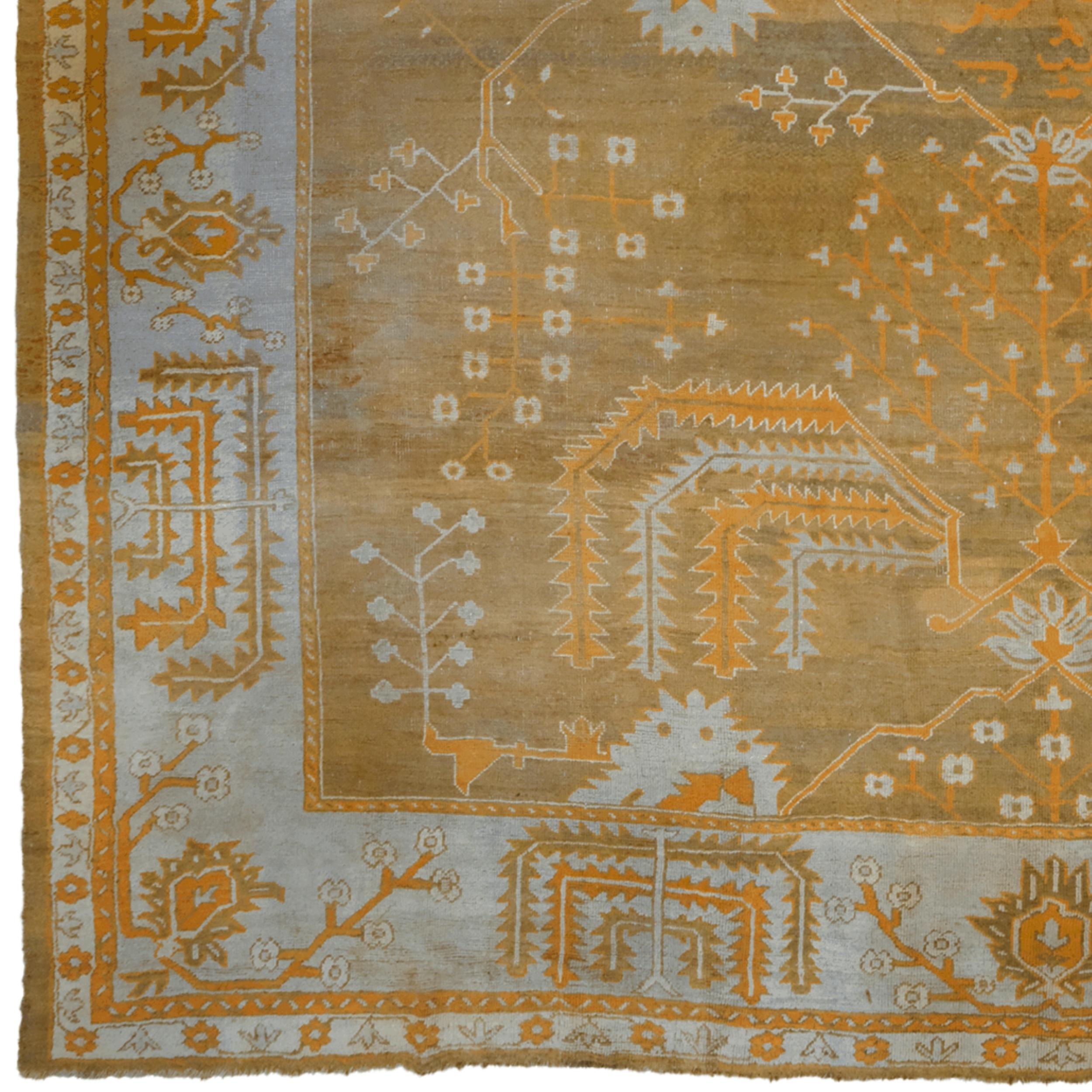 This unique antique Ushak carpet is a masterpiece reflecting the timeless elegance and mastery of Ottoman carpet art. Meticulously woven in the late 19th century, this carpet was produced using traditional Ushak weaving techniques and has great