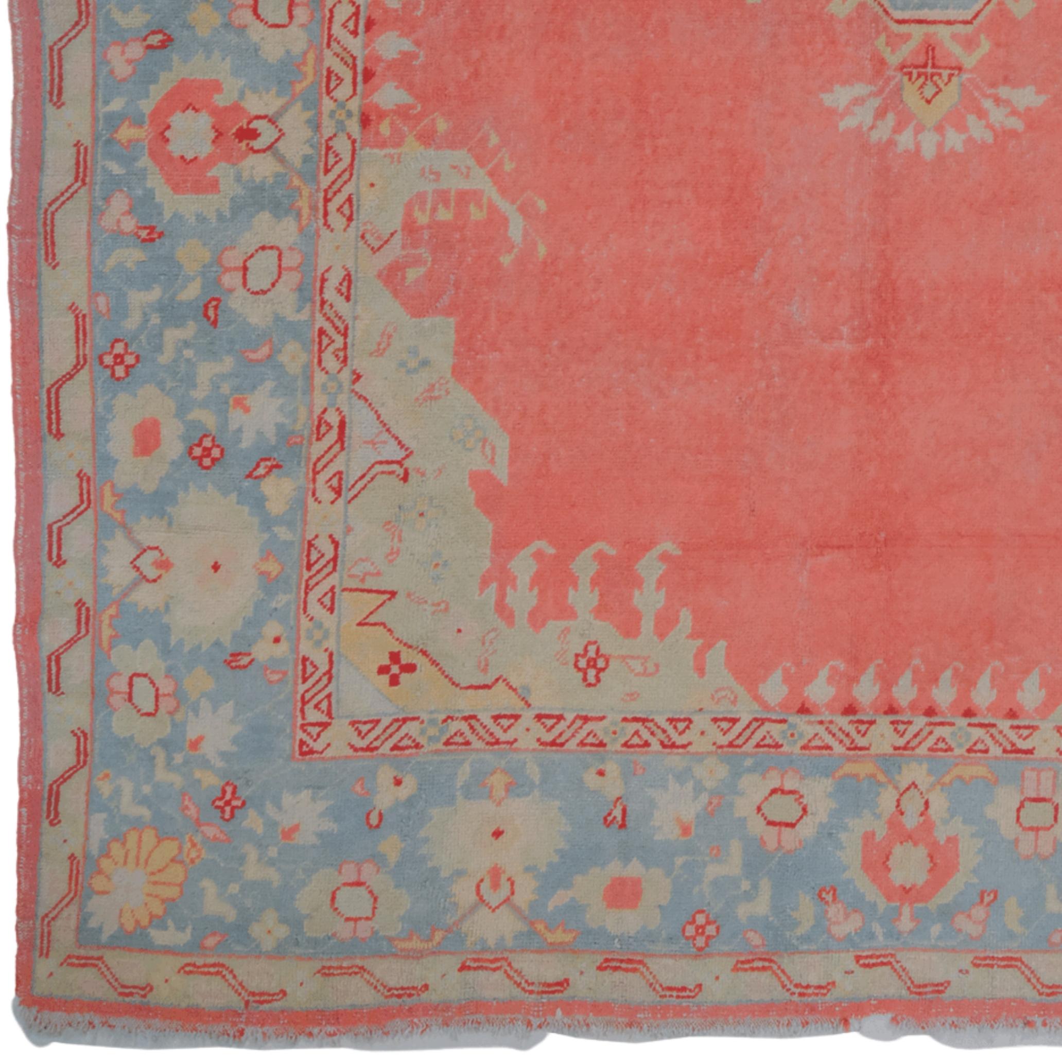 Late of 19th Century Ushak Carpet

This rare Ushak rug, dating from the mid-19th century, boasts an elegant and striking appearance. The blue, yellow, and white floral motifs on the red background demonstrate exquisite craftsmanship and color