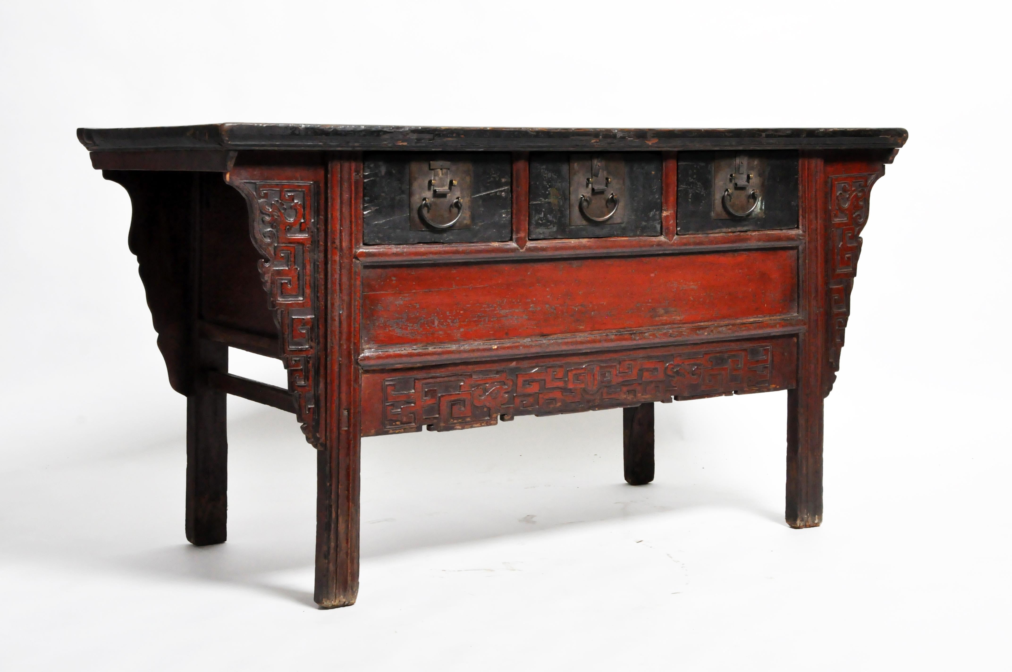 This gorgeous altar coffer is from China and was made from elmwood and lacquer circa 1880. The piece features its beautifully aged original patina with three drawers for storage. The coffer is from the late Qing dynasty period.