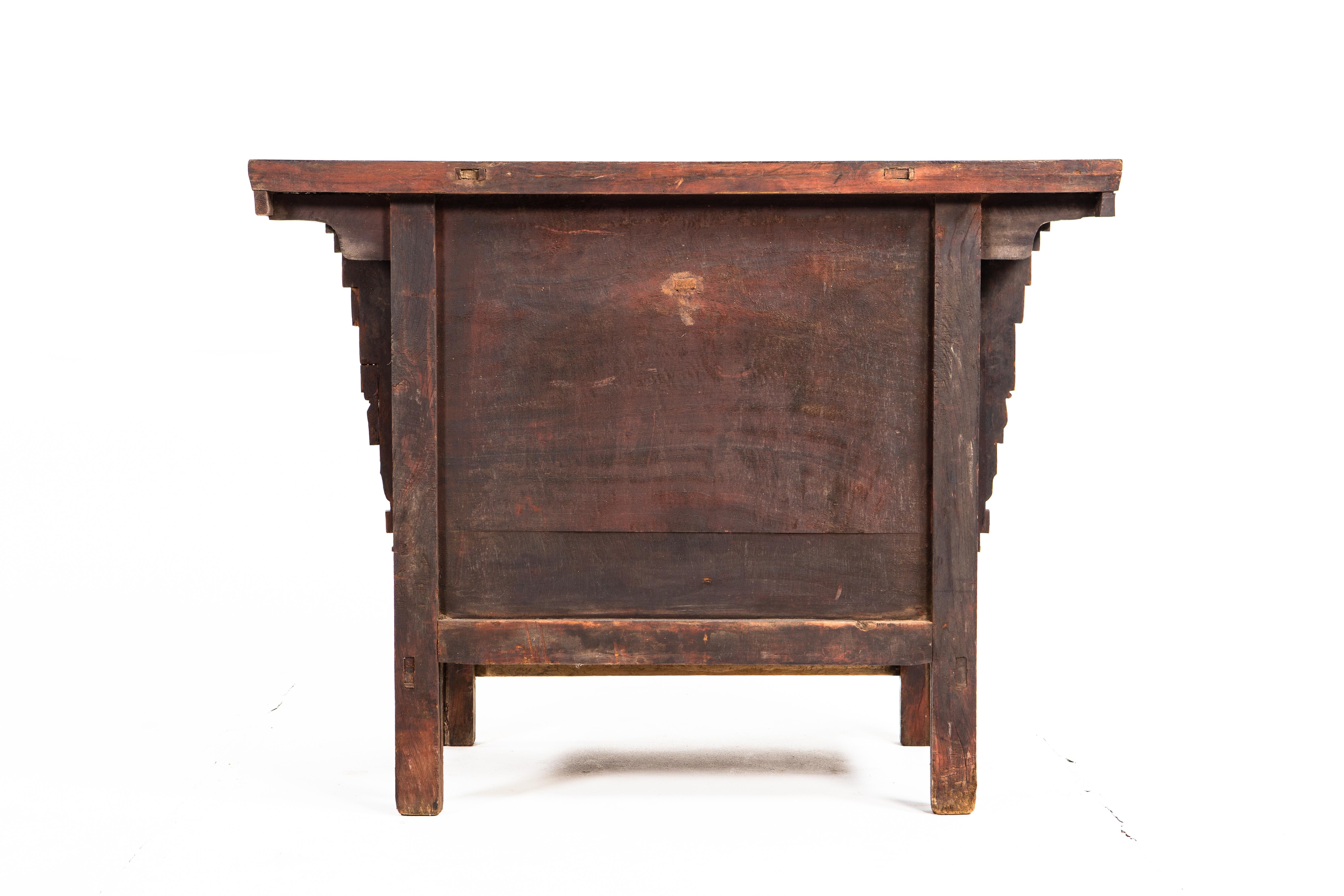 This handsome chest from Shandong, China is made of elm wood and dates to the late Qing dynasty. The piece features intricate hand-carved details and an original patina. Behind its two doors is ample storage, including a single drawer.
