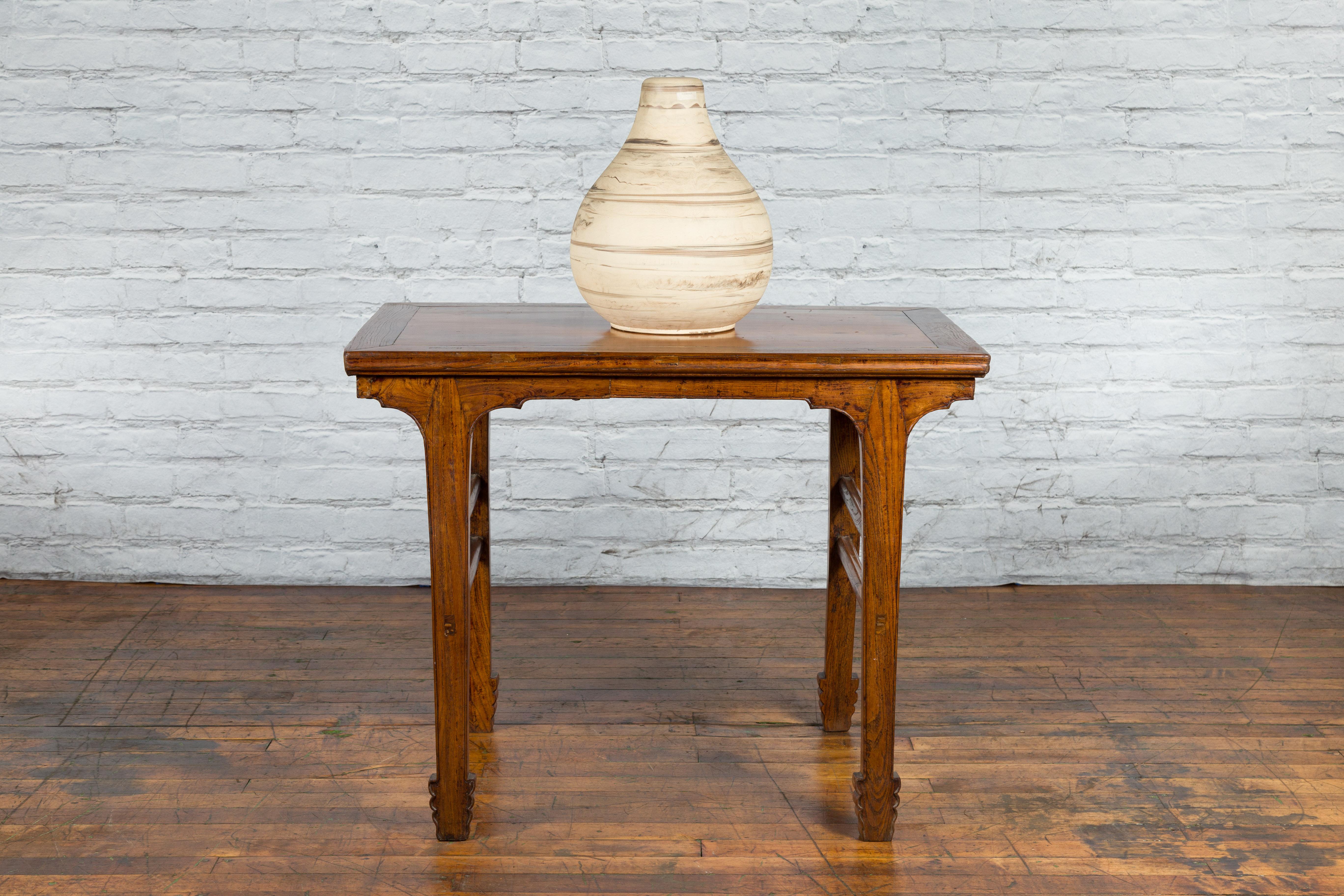 20th Century Late Qing Dynasty Chinese Elm Wine Table with Carved Legs and Side Stretchers For Sale