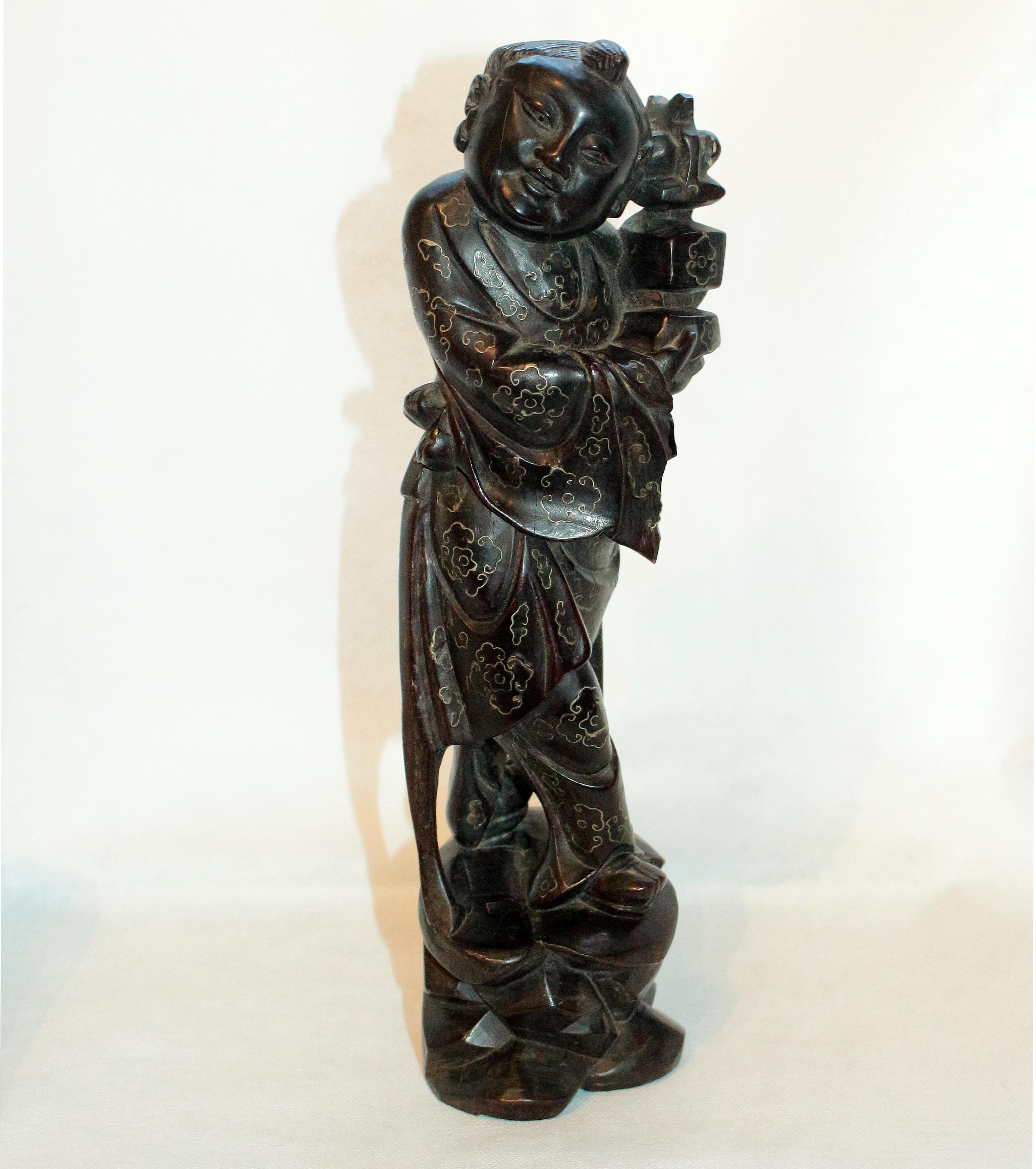 Hardwood carving of an immortal with silver wire inlay. Happy face. Chinese, later Qing dynasty. Splits & sleeve loss. 10 3/4