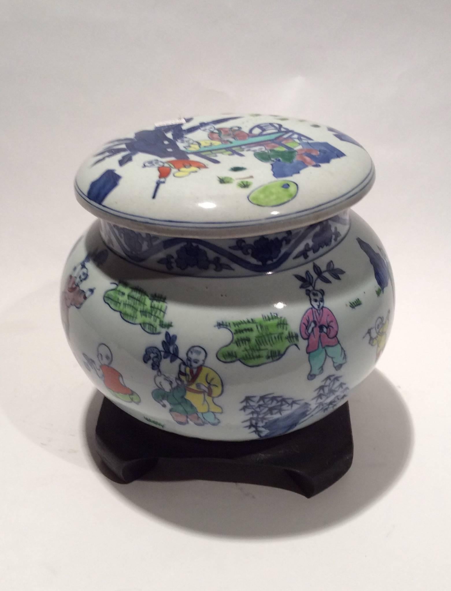 Five-color porcelain jar hand-painted with various scenes of children playing.