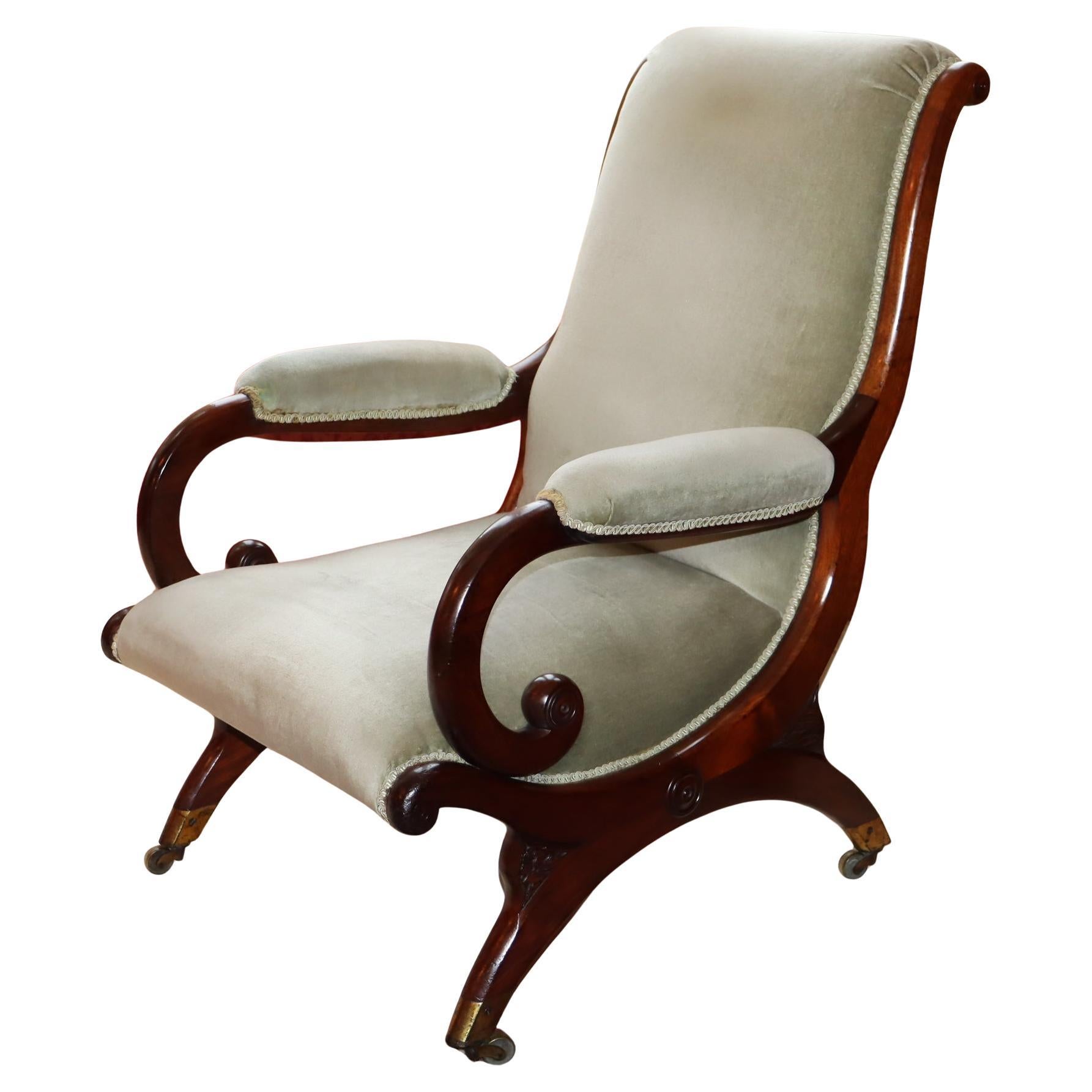 Late Regency mahogany X frame library chair