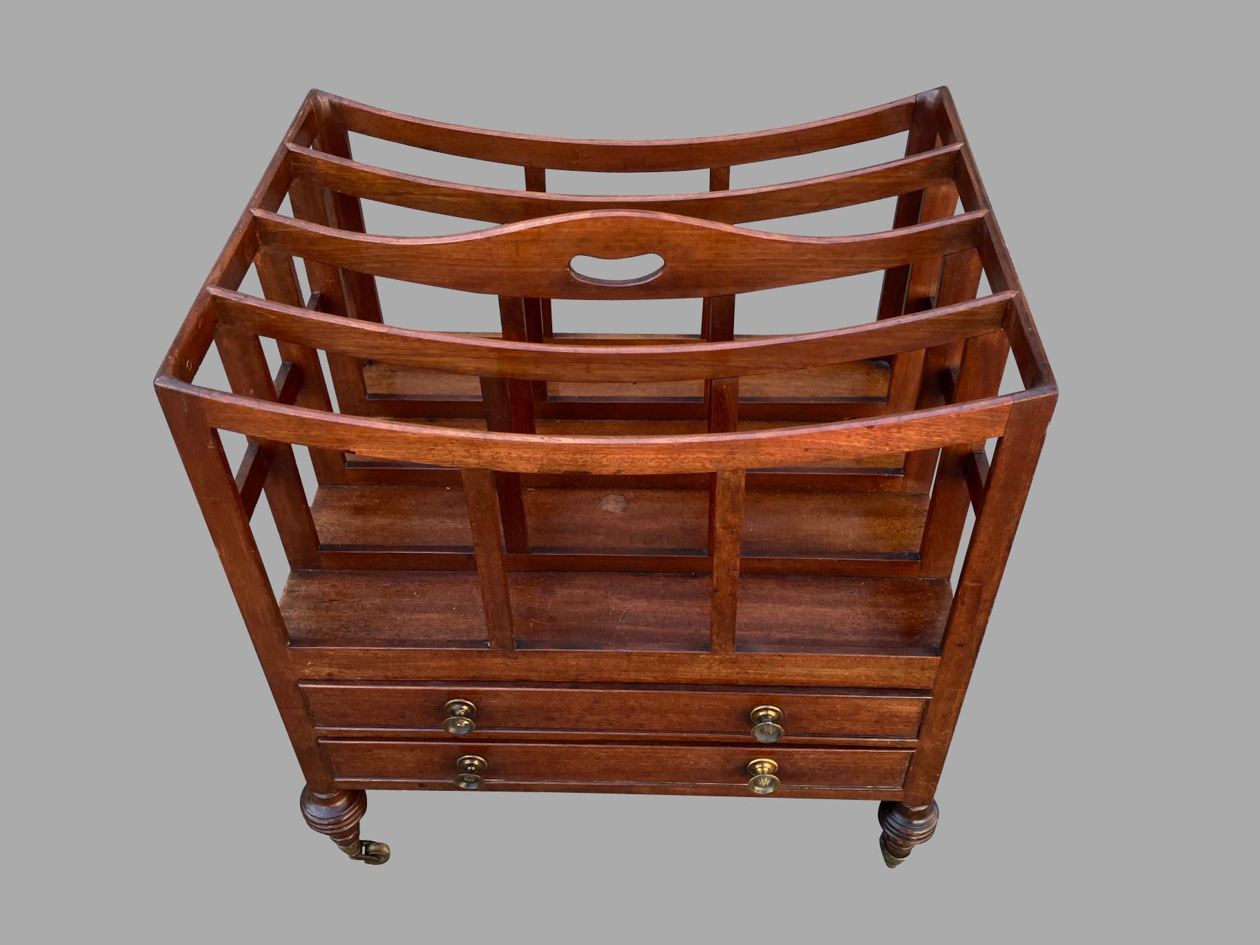 A fine quality English Regency period 4 section canterbury, the sloped top section with a central cut out carry handle above 4 compartments, with 