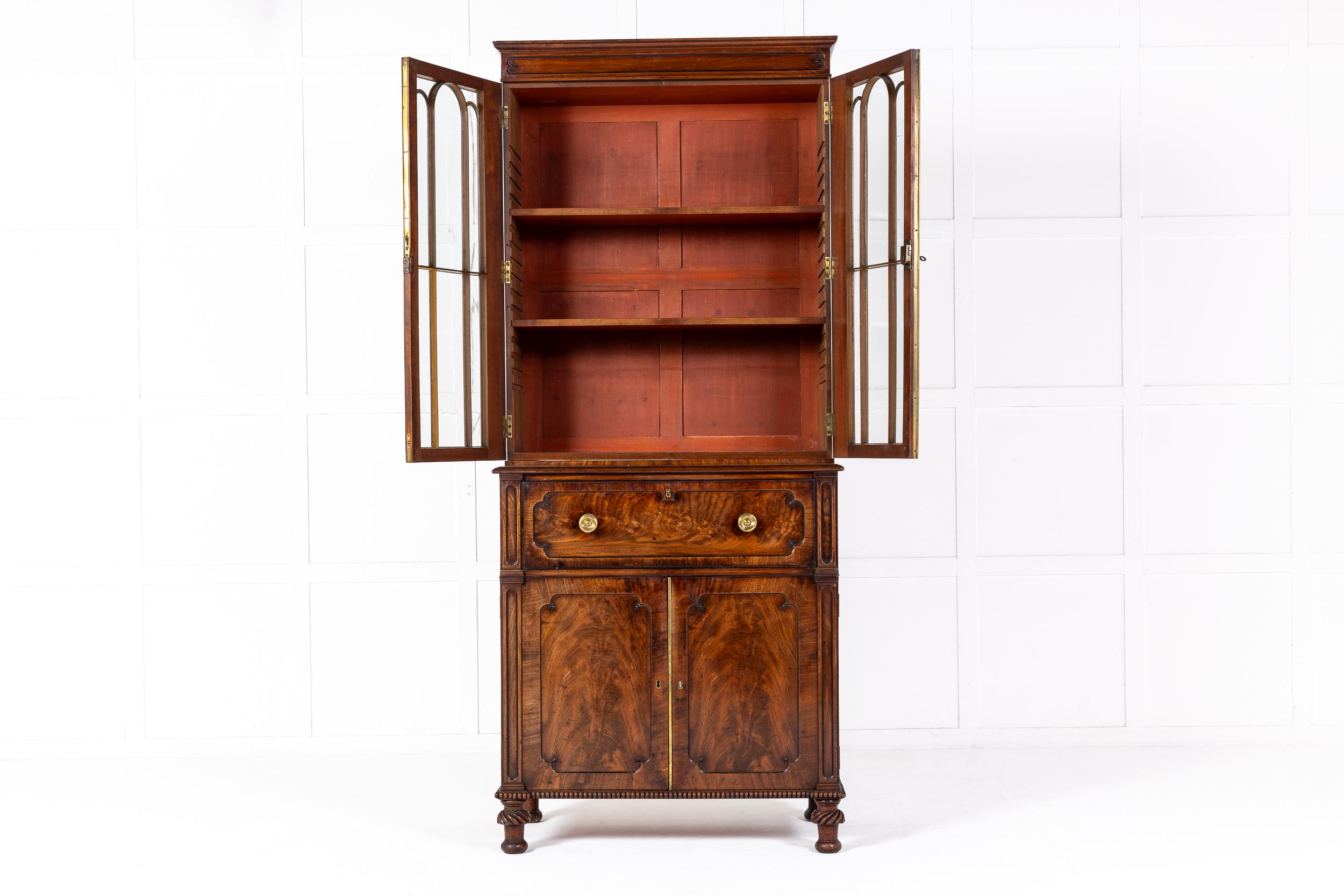 A Very Fine Late Regency Period Mahogany Secretaire Bookcase in the Manner of J. C. Loudon c.1825-30.

Of fine and small size, this charming piece is in a restrained gothic style with arched astragal glazing bars to the upper bookcase doors and