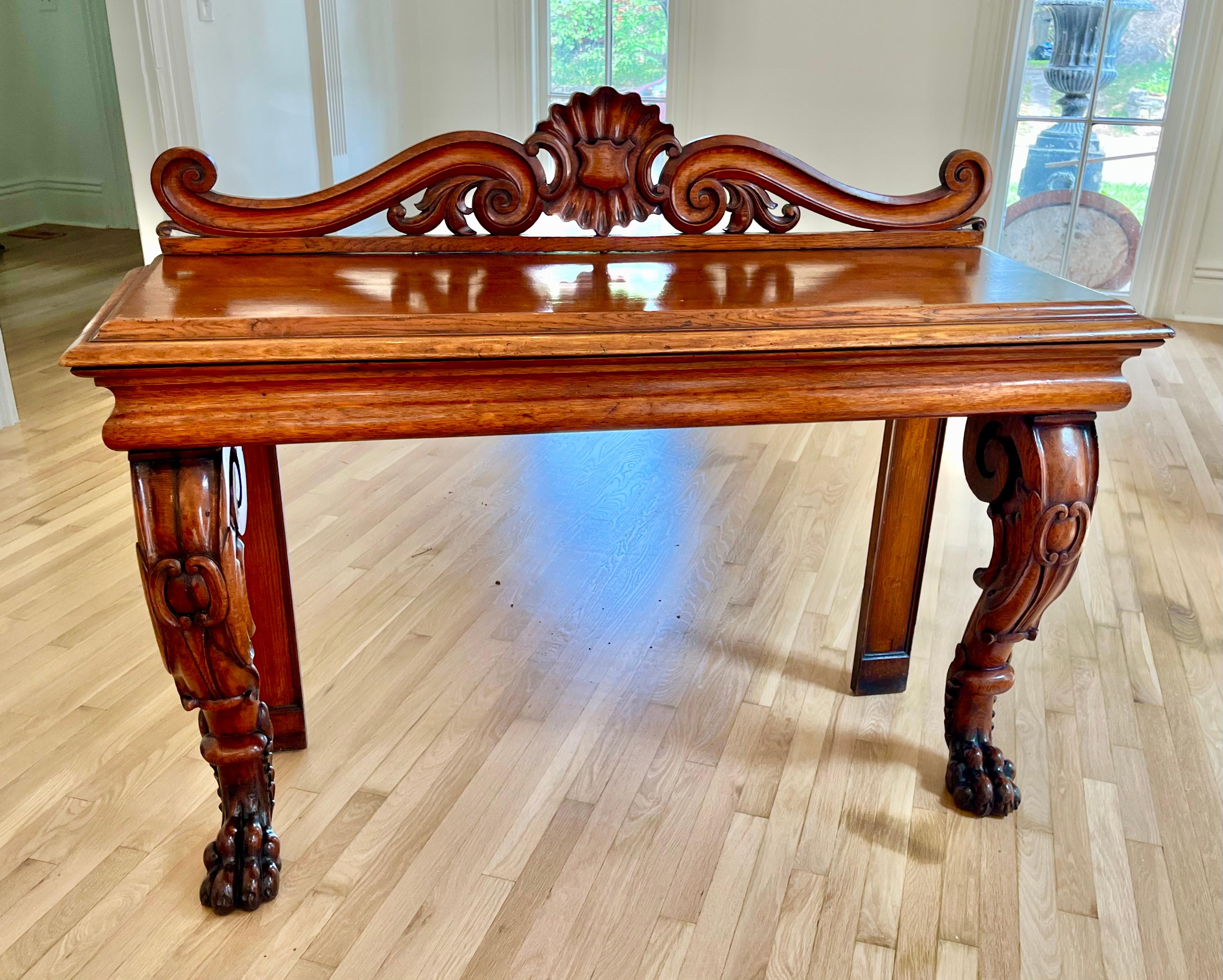 With a fine shellac polish finish. The wood a nice warm cognac color and presents very well .  In sturdy condition ,slight wear and some darkening to the richly carved paw feet (fully intact). Some old filled age cracks (note filled crack on one leg