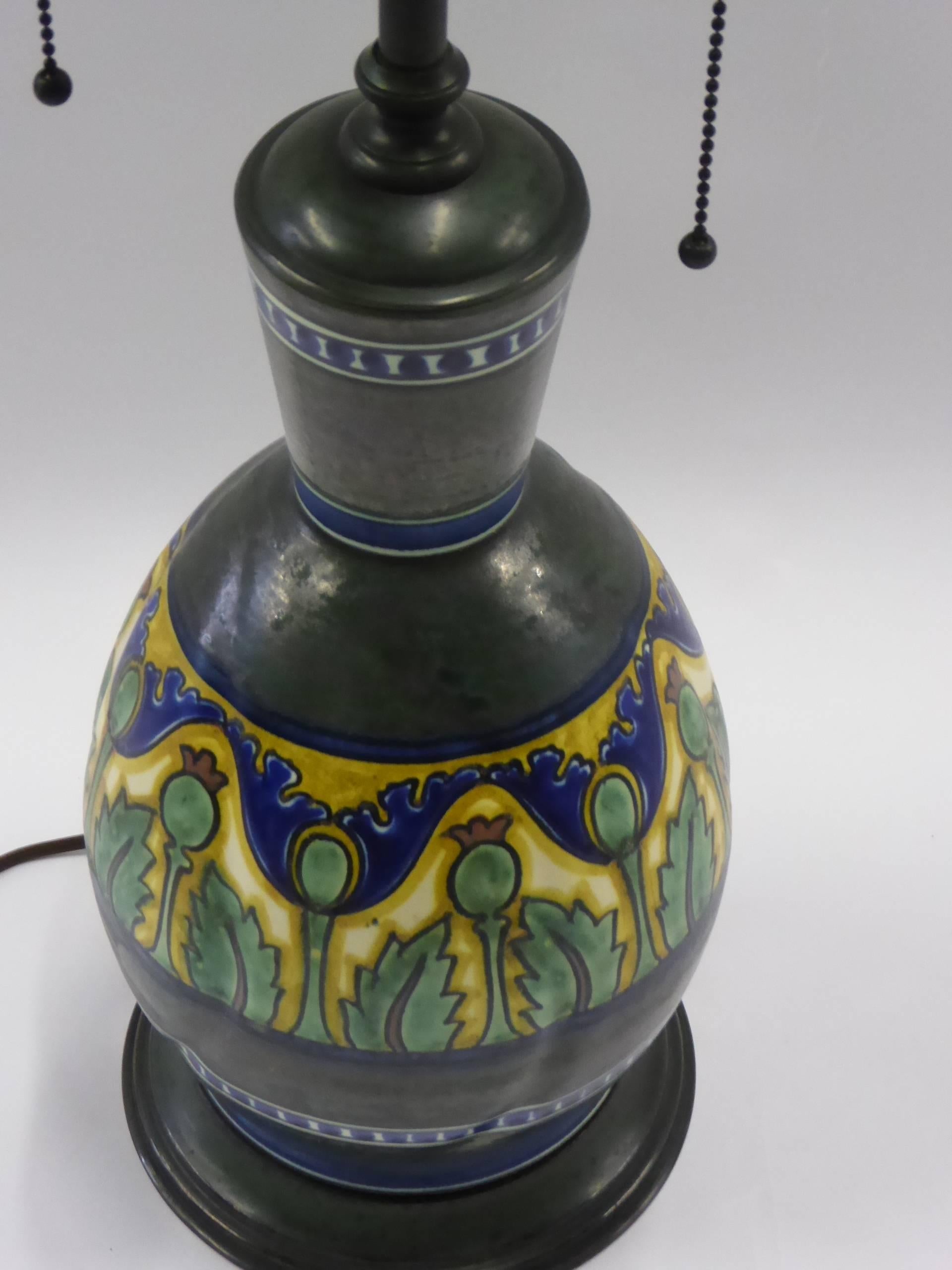 Beautiful Art Nouveau Gouda Damascus III vase mounted as a table lamp. Vase originally made by Gouda Plaatelbakkerij Zuid-Holland between 1911-1919. Vase marked on the underside with appropriate PZH marks for the period. Mounted with metals having