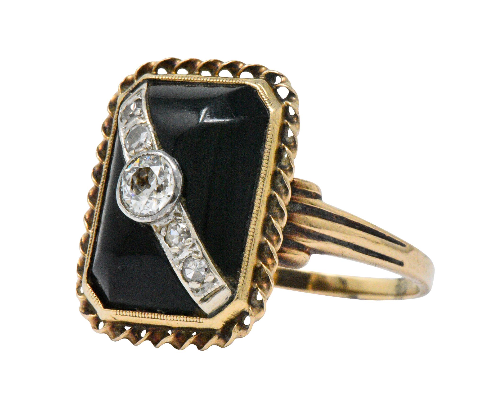 Centering an old European cut diamond with single cut diamond accents, weighing approximately 0.25 carats total, eye-clean and white

Buff-top onyx with twisted gold frame

Tested as 10k gold

Ring Size: 5 3/4 & Sizable

Top measures 16.8 mm and