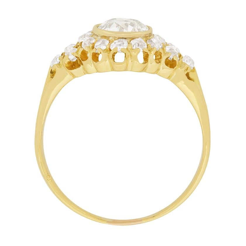 This gorgeous late Victorian ring showcases a 1.01 carat diamond surrounded by 0.54 carat of old cut diamonds. The centre old cut diamond is I colour and SI1 clarity. An array of smaller diamonds are set into the shoulders, creating a glittering