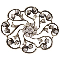 Late Victorian 1.10 Carat Total Diamond Flower Cluster Brooch in Gold and Silver