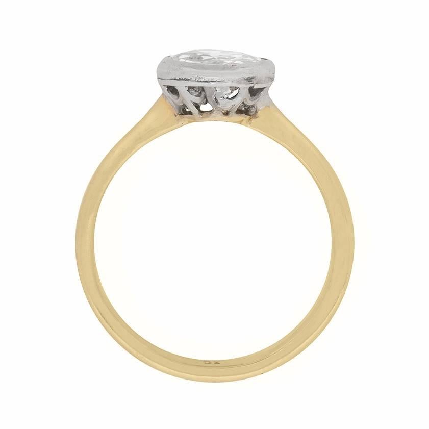 An original turn of the (twentieth) century engagement ring, presenting a 1.35 carat old cut diamond in a rubover platinum mounting set atop an 18 carat yellow gold shank.

Gemstone: Diamond
Carat Weight: 1.35
Stone Shape: Old Cut
Colour: J
Clarity: