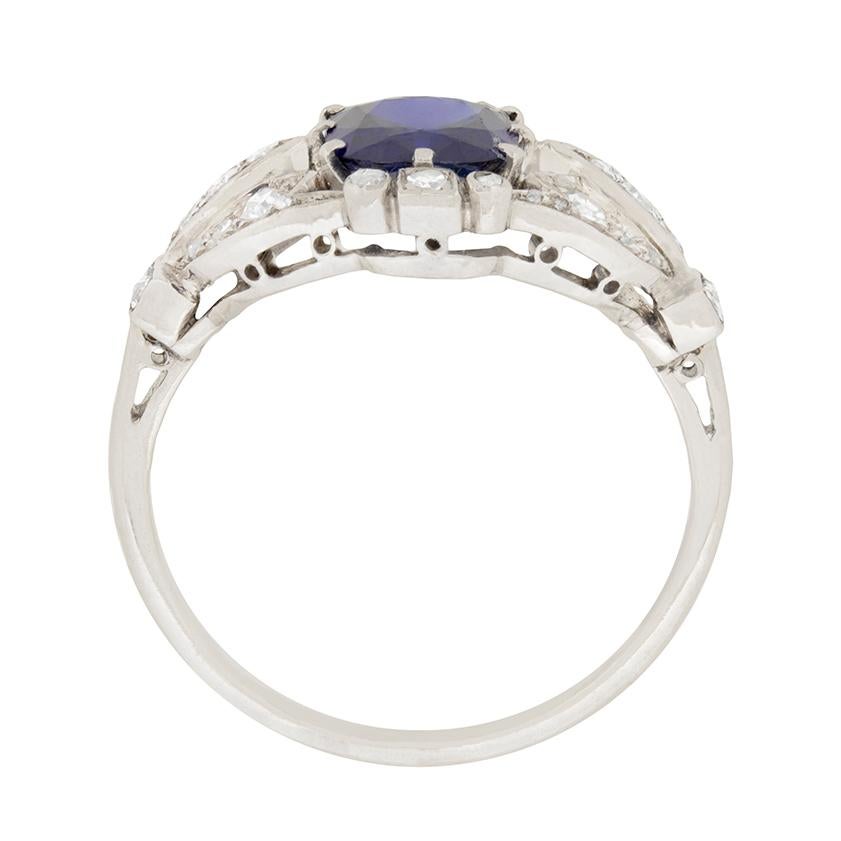 A wonderful Sapphire and Diamond cluster ring dating to approximately 1900. It has a classic Victorian style to the intricacy of the metal work and setting of the eight cut diamond, and rose cut diamonds which enhance the stunning centre sapphire.