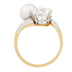 Late Victorian 1.70ct Diamond and Pearl Two Stone Twist Ring, c.1900s