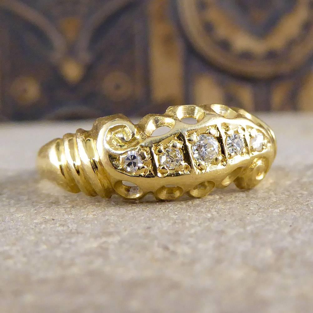 This pretty antique ring was crafted in the Late Victorian era and features five diamonds in a scroll gallery design. Modeled in 18ct yellow gold, it looks exquisitely classic on the hand!

Ring Size: UK L 1/2 or US 6 

Condition: Very Good,