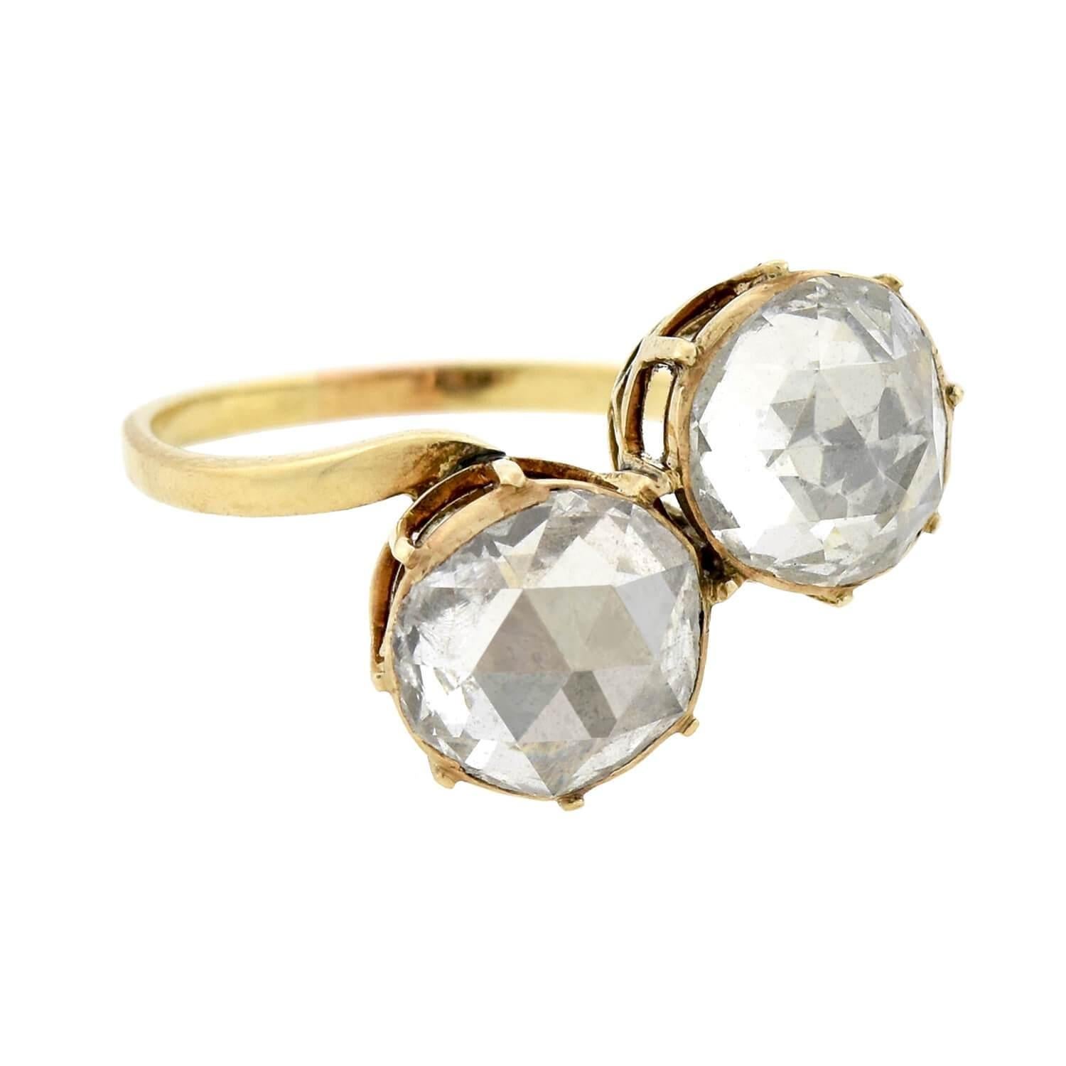 An absolutely stunning Moi et Toi ring from the late Victorian (ca1900s) era! Crafted in 18kt yellow gold, this gorgeous piece features two generously sized old Rose Cut diamonds which sparkle within closed, foil-backed settings. Collectively, the