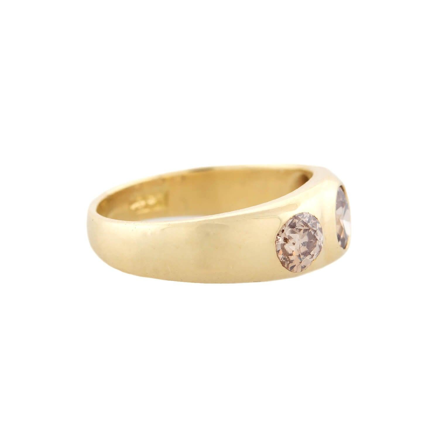 A gorgeous diamond gypsy ring from the Late Victorian (ca1900s) era! Crafted in 18kt yellow gold, this ring is set with three beautiful Old Mine Cut Diamonds in flush bezel settings. The diamonds weigh an approximate total of 1.75ctw and display an