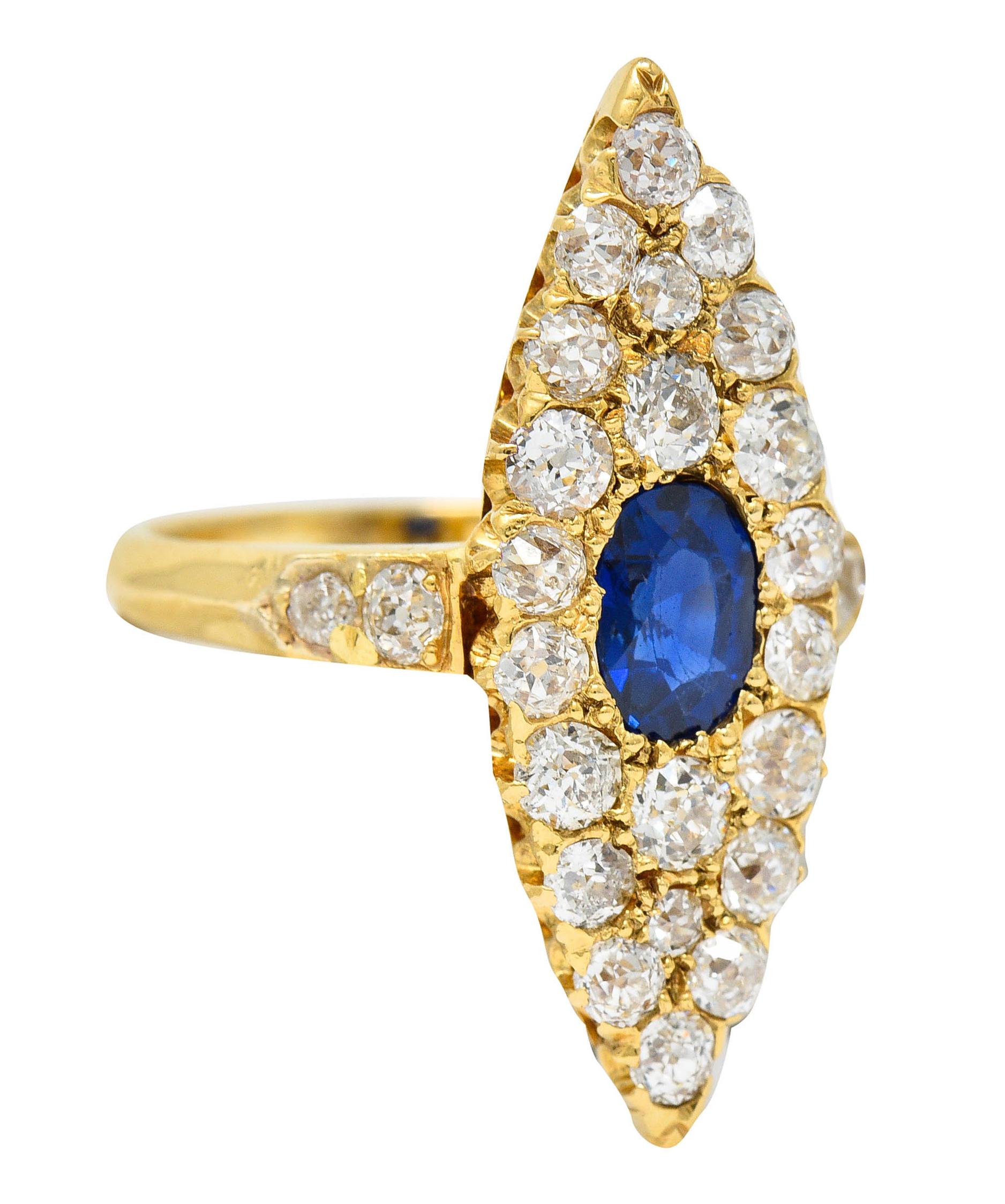 Navette shaped cluster ring centers an oval cut sapphire

Weighing approximately 0.62 carat with medium dark royal blue color

Surrounded by old mine cut diamonds weighing in total approximately 1.46 carats - G to J color with SI clarity

Tested as