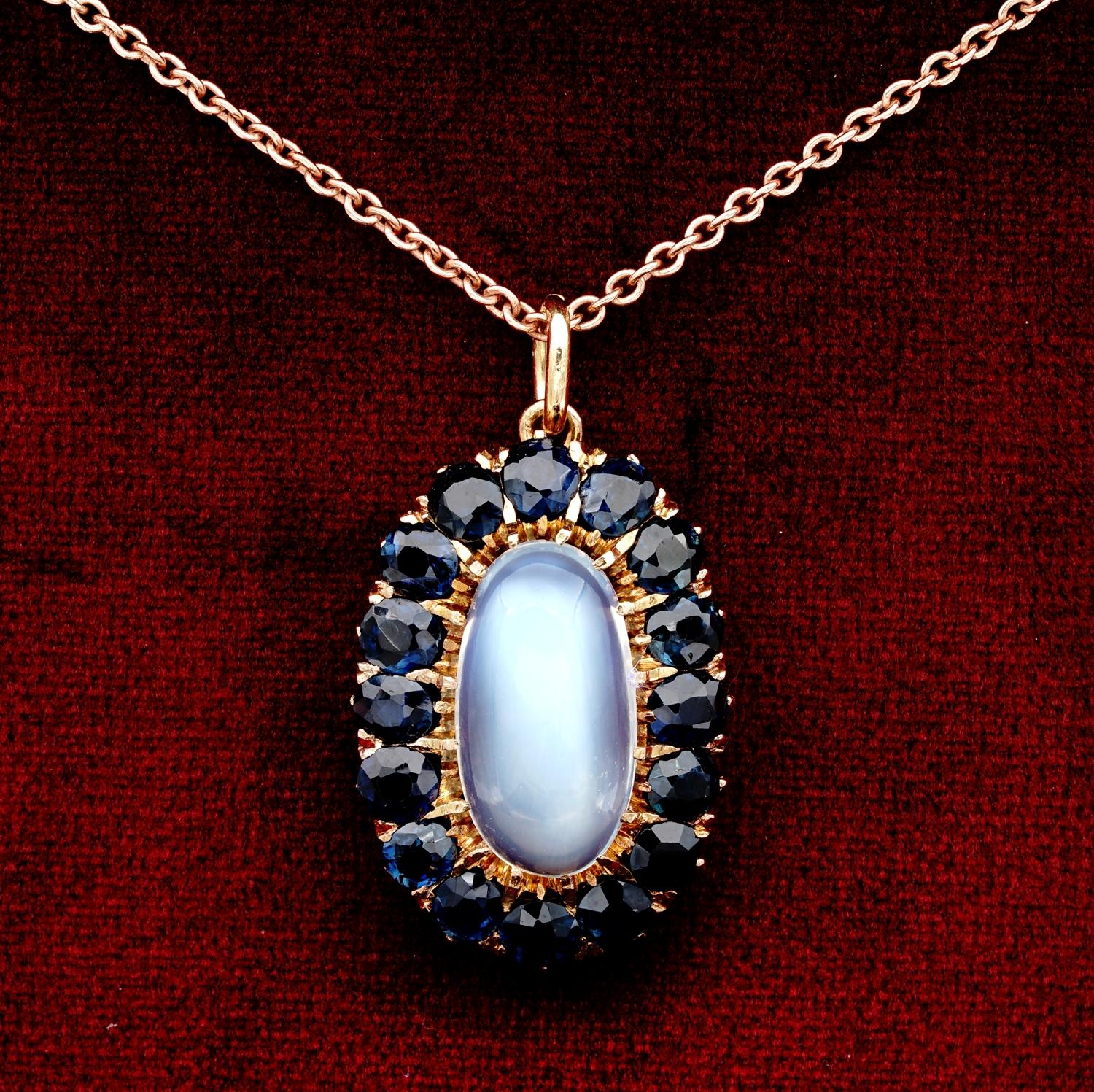 Dropped from Moon!

This truly gorgeous, late Edwardian pendant, is a lovely composition of gemstones: shimmering Moonstone, old cut opulence of natural sapphires
Mounted in 18 Kt rose gold with a lovely elongated shape taking inspiration by the
