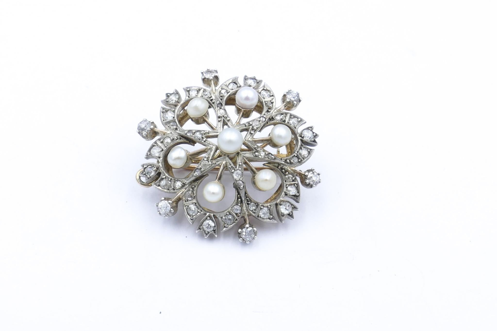 7 Cultured Pearls 4.24mm - 4.35mm diameter, near round, white with cream overtones add the highlight to this beautiful piece of Victoriana, a Snow Flake Pendant with the additional wear as a Brooch.
The Pearls centre 48 Diamonds of mixed cut Old