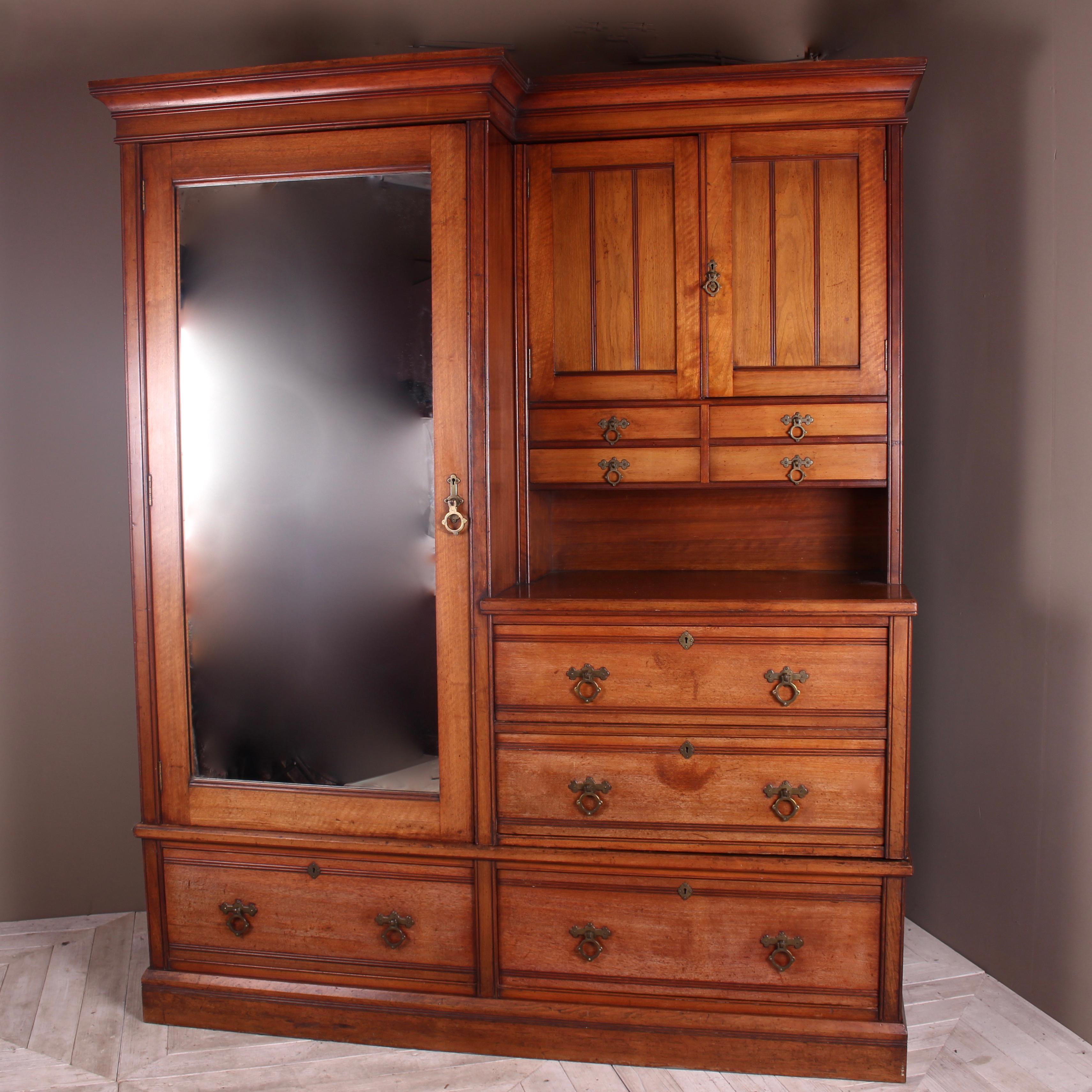 A beautifully made Victorian Compactum walnut wardrobe by W Walker & Sons with wonderfully clean and simplistic lines of the Aesthetic Movement, circa 1880. Comprising of a wardrobe hanging space to the left with clothes rail, original hooks