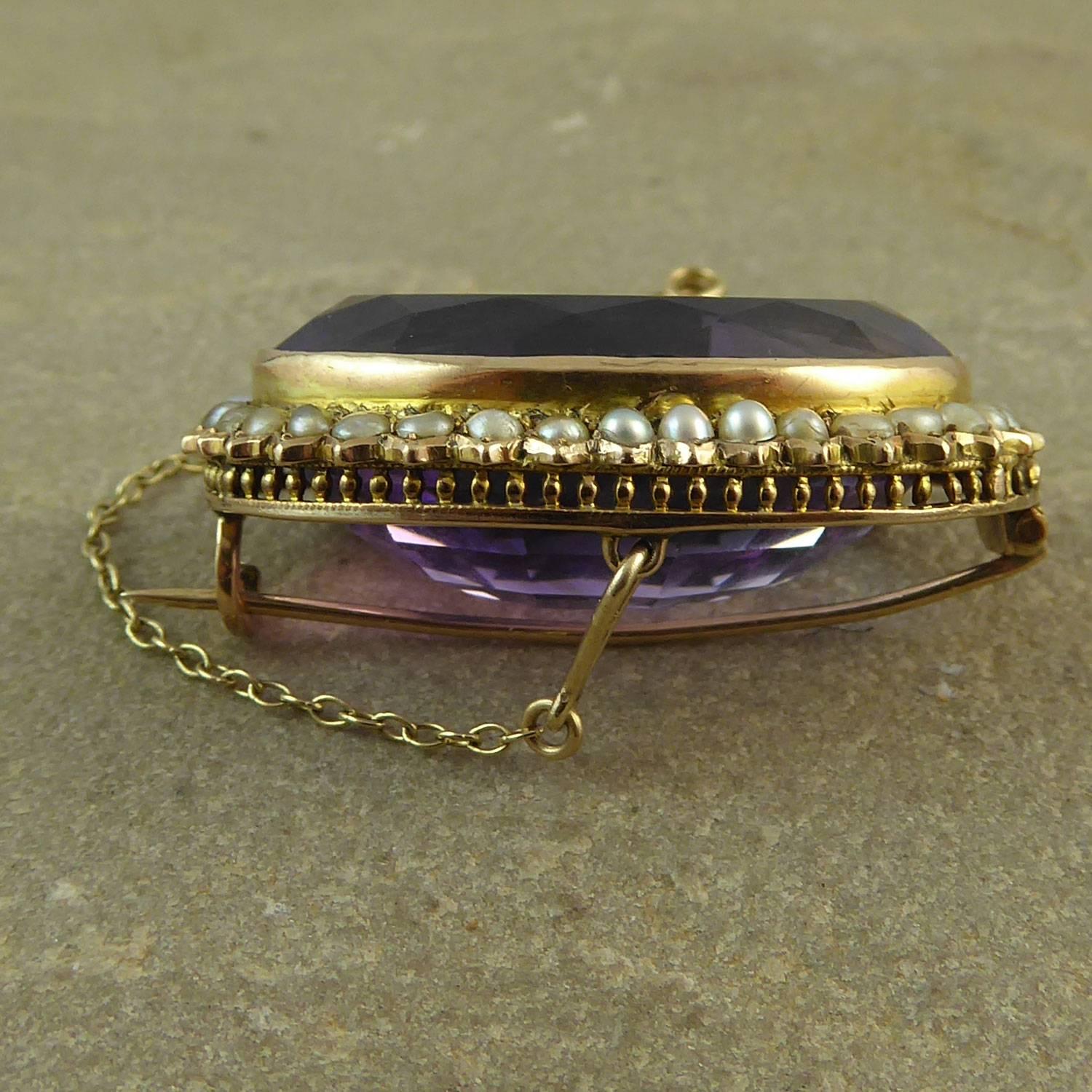 A grand amethyst and pearl brooch from the later Victorian era set with an utterly beautiful oval and faceted amethyst in a shade of purple that's not too dark, not too pale - just 