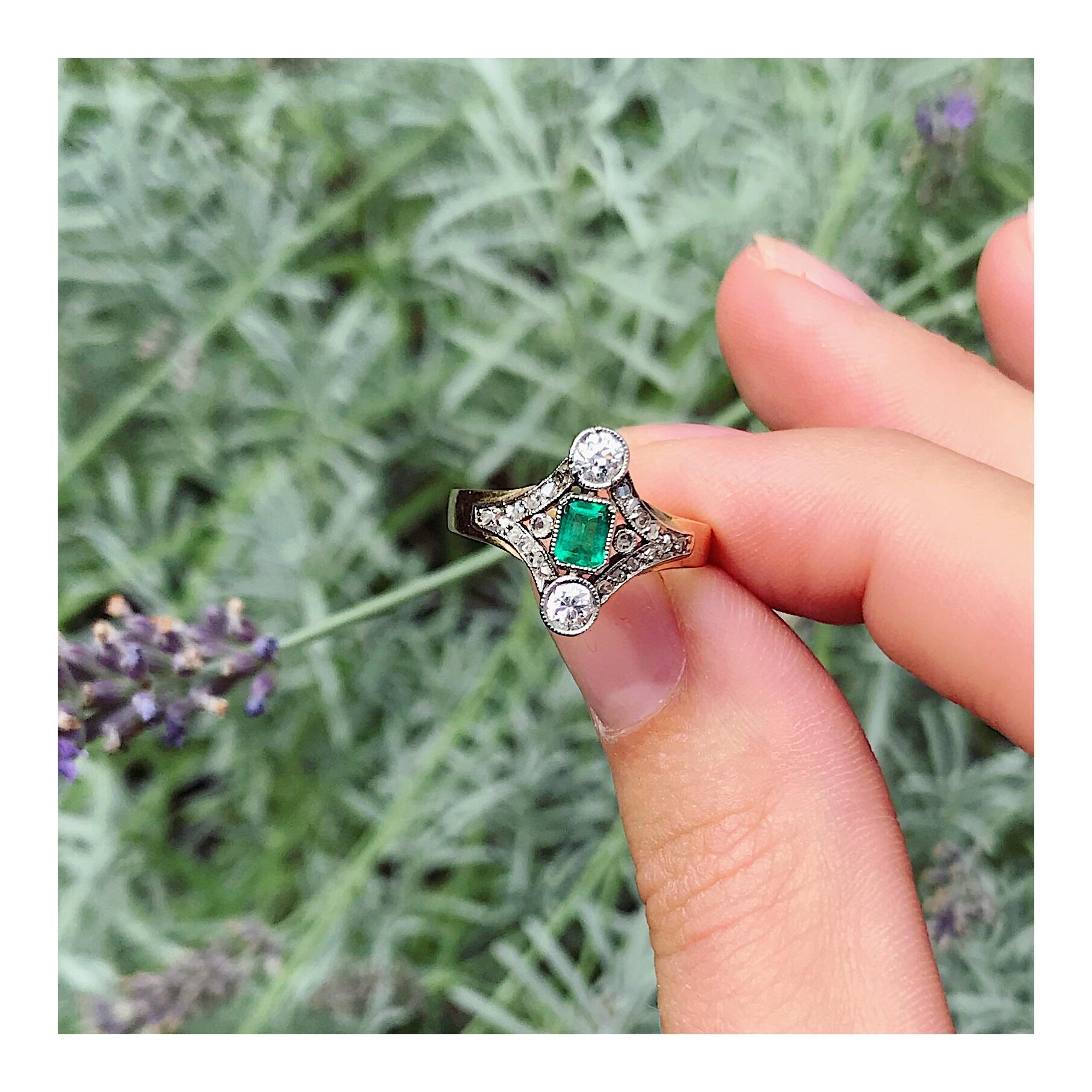Through the rectangular cut verdant emerald in a vertical sequence between two old European cut diamonds, this 14K yellow gold Late-Victorian ring from 1900 shows the star alignment of any union meant to be. A row of rose cut diamonds sprouts from