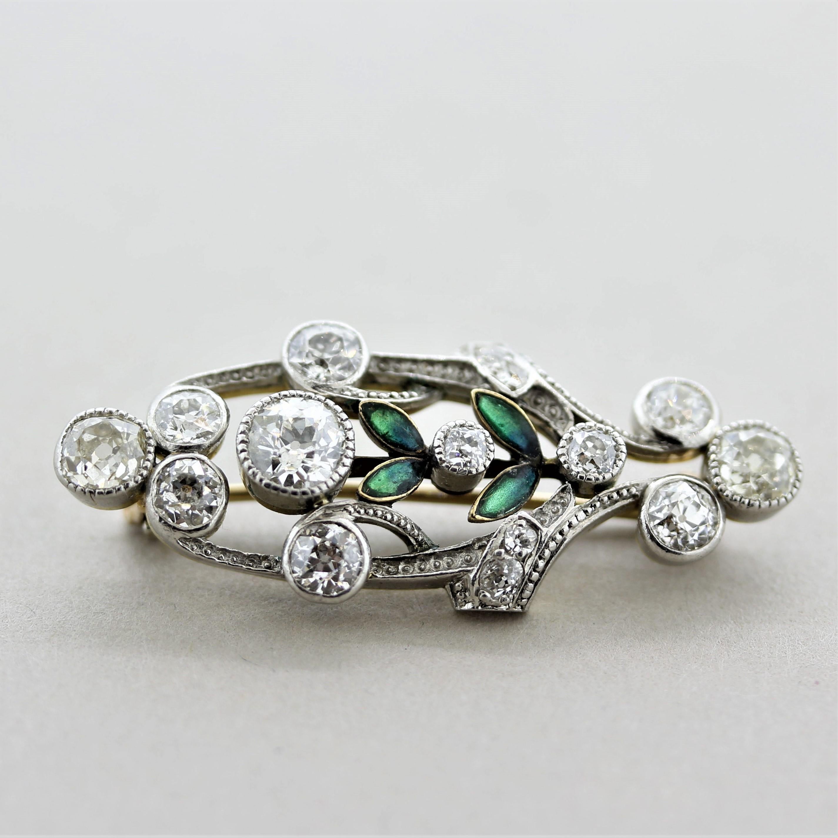 A superb piece of jewelry, circa 1900, from the end of the Victorian era. It features approximately 3.00 carats of large European-cut diamonds set around the pin. It is accented by 4 green-blue enameled leaves giving the piece a natural look. Made