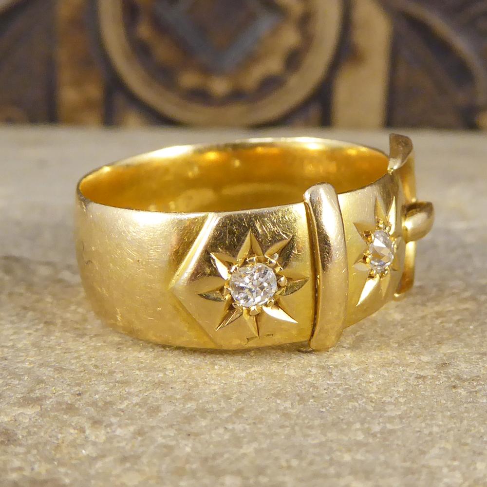 This gorgeous ring is crafted as a wide buckle with two old mine cut Diamonds set into the top, and created in the Late Victorian era. The back of this ring is unadorned, a classic buckle design crafted in 18ct Yellow Gold. Buckles were often made