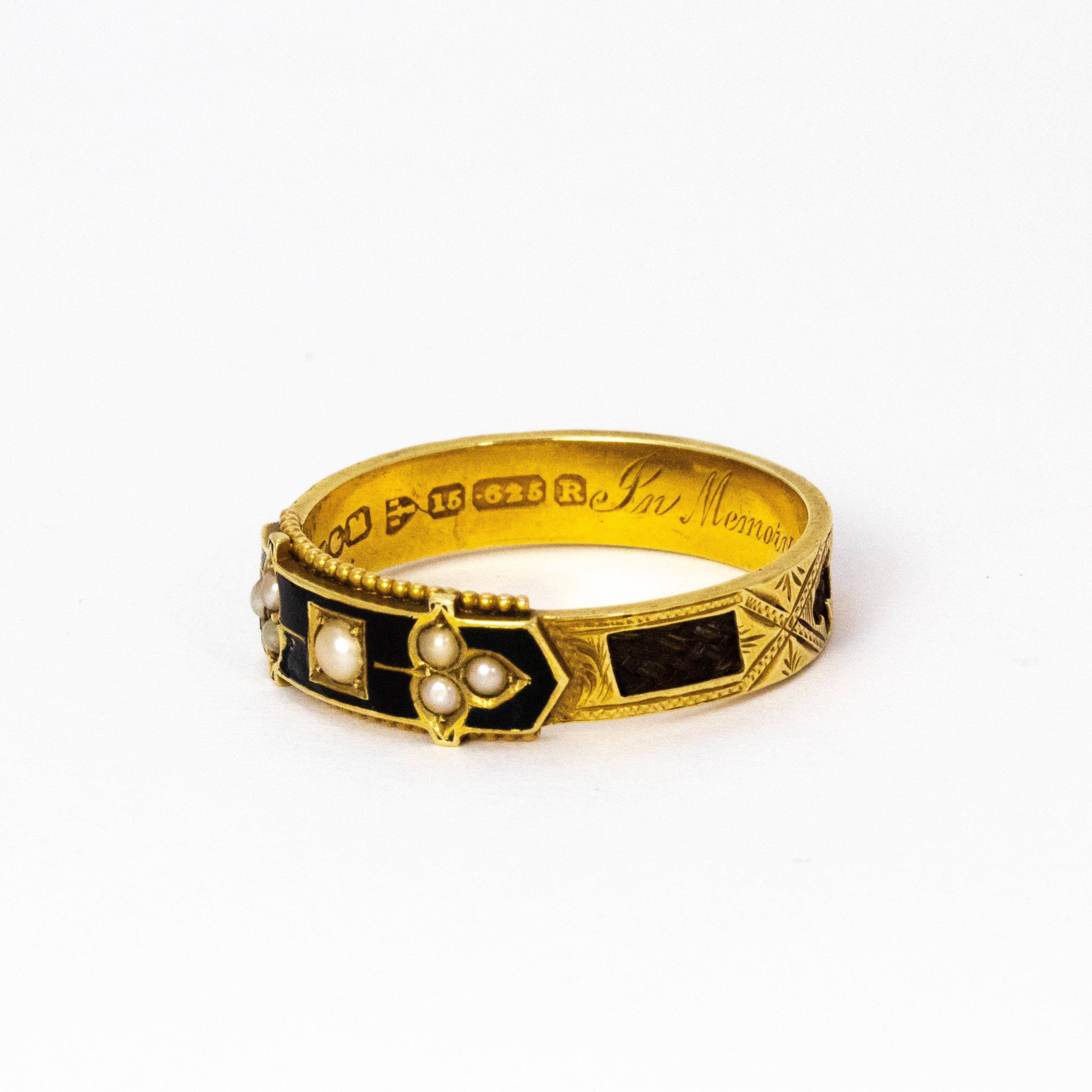 A very fine late Victorian black enamel and seed pearl mourning ring. The black enamel panel highlighted with small seed pearls, with plaited hair inserts and with chased and engraved detail, further engraved inside 
