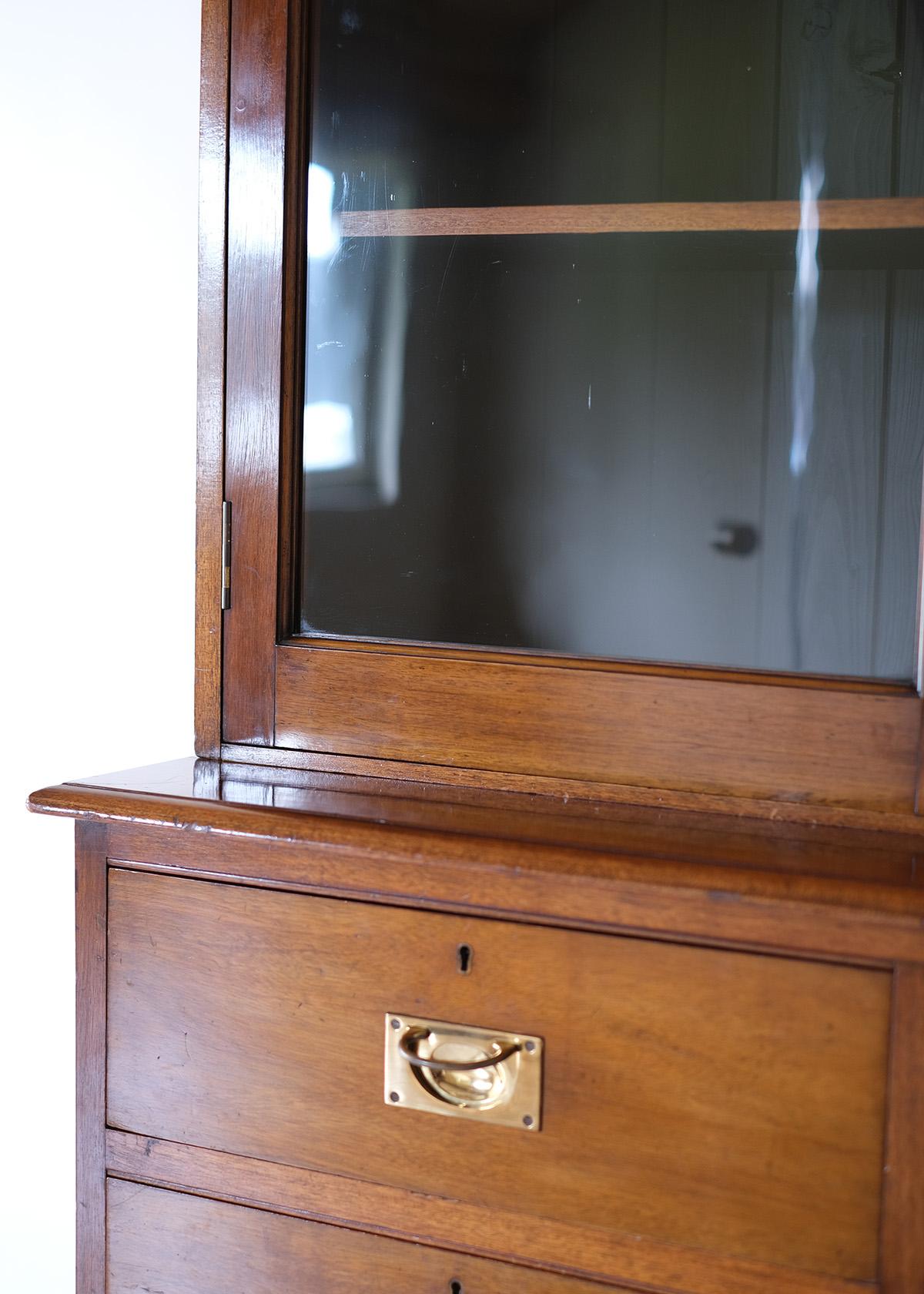This beautiful Victorian cabinet captures the essence of a bygone era with its intricate woodwork and original glass features, showcasing the craftsmanship that defined the period. Its dual role as a functional storage unit and a piece of artistry
