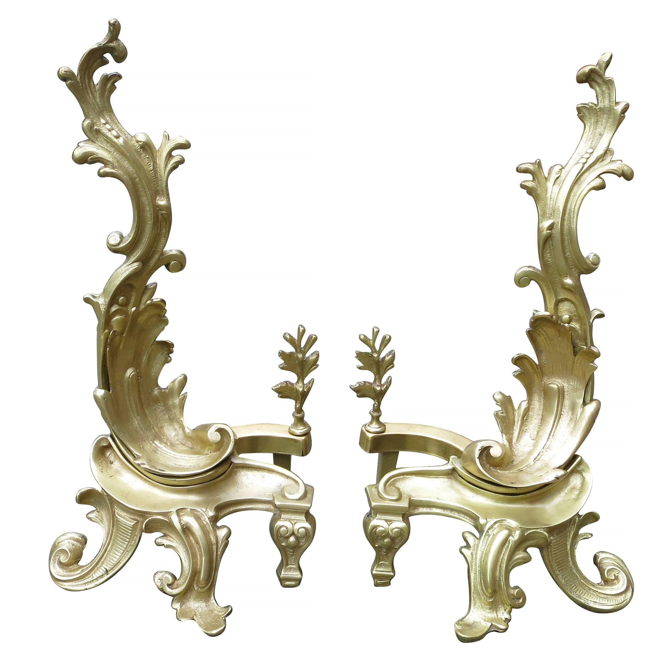 Late Victorian brass andirons featuring two Rococo late-Baroque styled in Classic asymmetrical patterns. 

Made, circa 1890.

 