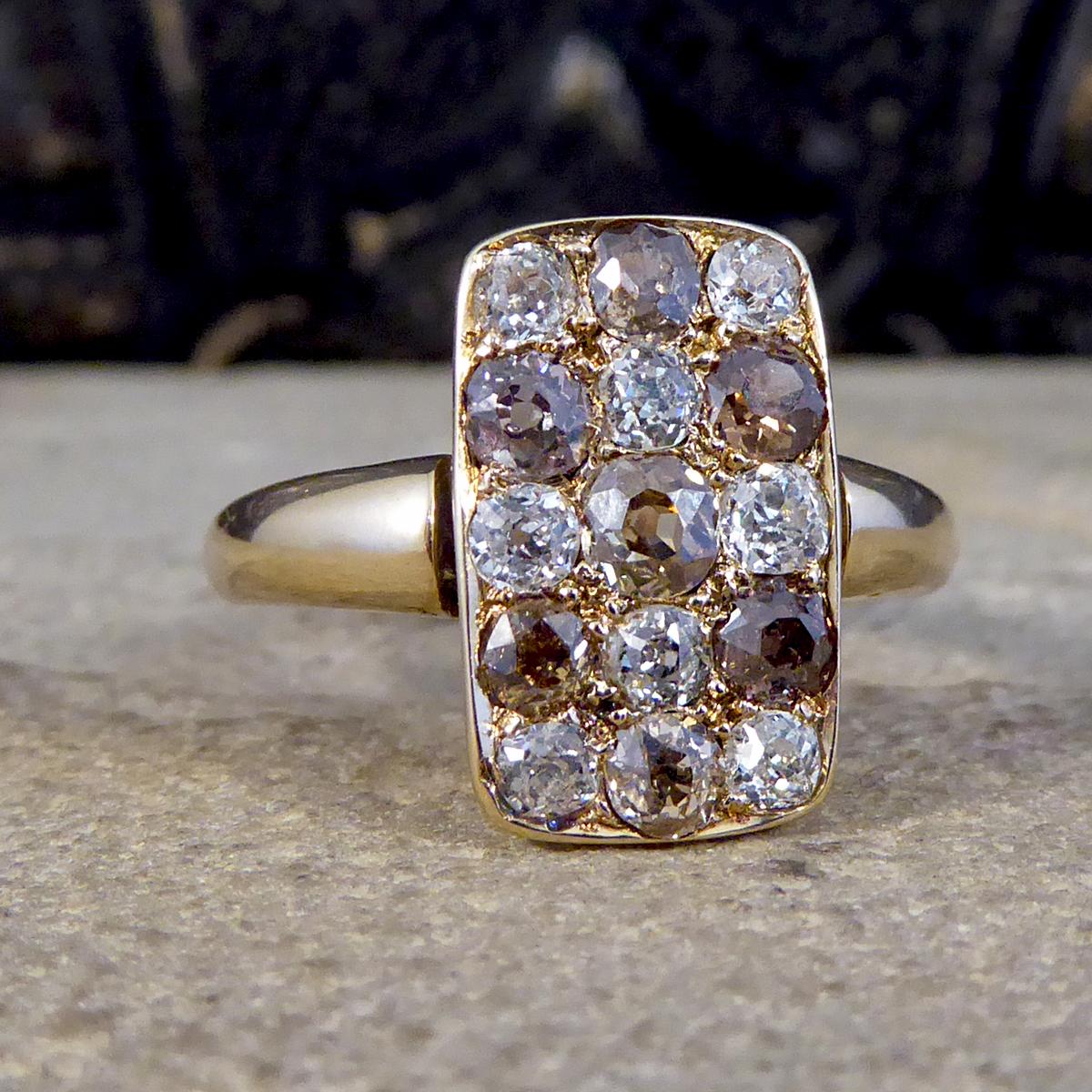 Such an amazing and especially lovely chequerboard ring, set with three columns of alternating Old European Cut Brown and White Diamonds. It has be modelled in 18ct Yellow Gold in the Late Victorian era. The band sits thicker at the shoulders