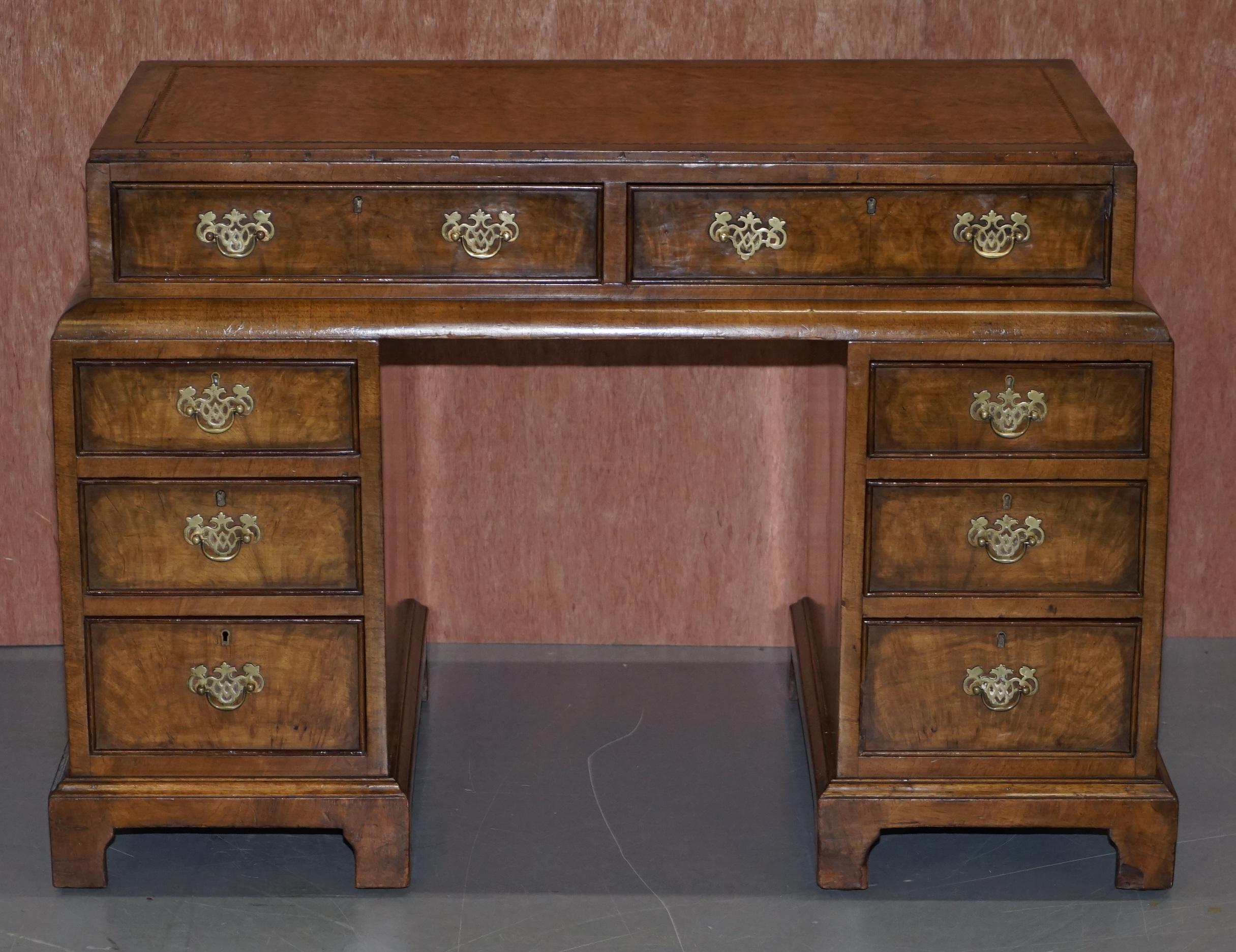 We are delighted to offer for sale this stunning original circa 1900 late Victorian burl walnut with brown leather writing surface pedestal desk made by Withy Grove Stores LTD Manchester

A very good looking and well made antique desk. The top is