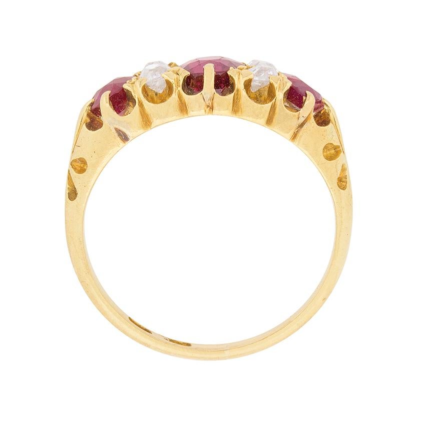 Vertically-set pairs of old cut diamonds alternate with three oval-shaped Burmese rubies in this classic example of a late Victorian era ring.

The ring is well-proportioned with the centre ruby weighing 0.85 carats, the two remaining rubies