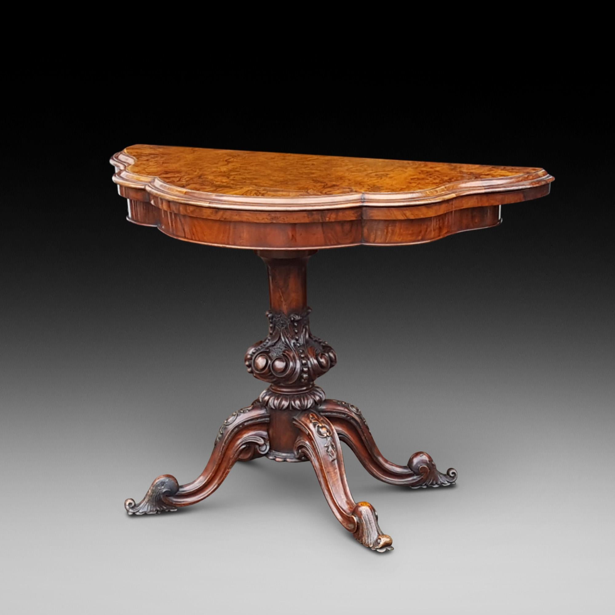 Late Victorian Burr walnut serpentine shape card table with turned and carved baluster column scroll legs and feet with blind castors 40.5