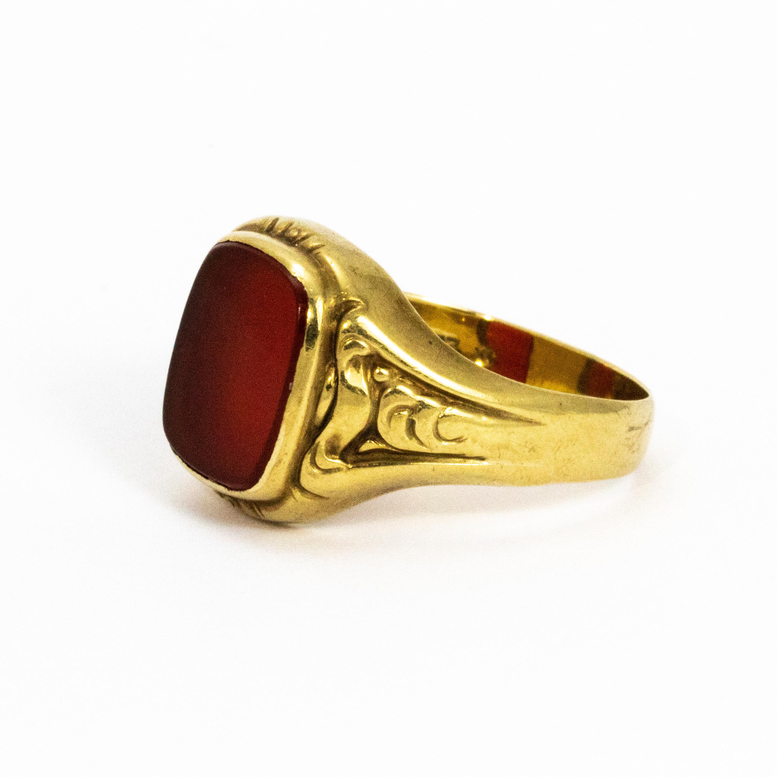Glossy Carnelian stone set in a decorative 8ct gold band.

Ring Size: S 1/2 or 9 1/2