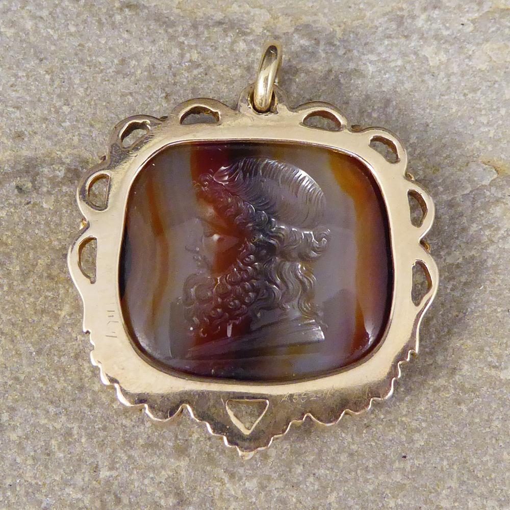 Such a lovely Antique pendant created in the Late Victorian era. The main part of this pendant features banded agate with a Greek God carved into it and all set in 15ct Yellow Gold with a lovely detailed border.

Condition: Very Good, slightest