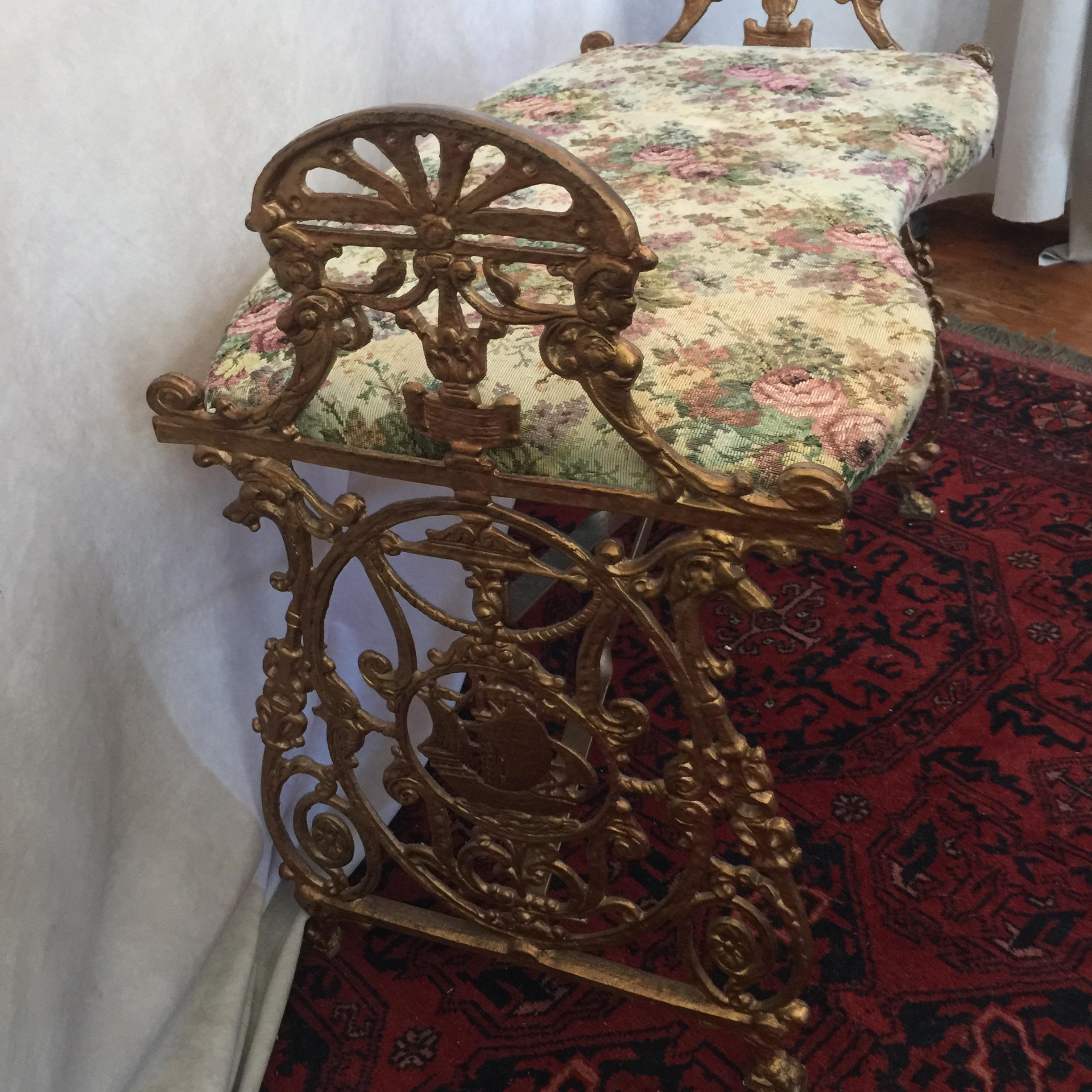 This cute little bench can fit almost anywhere in the home. Nicely upholstered and fancy metal work make this one a fun addition to the home. Very sturdy and well looked after in it's life.