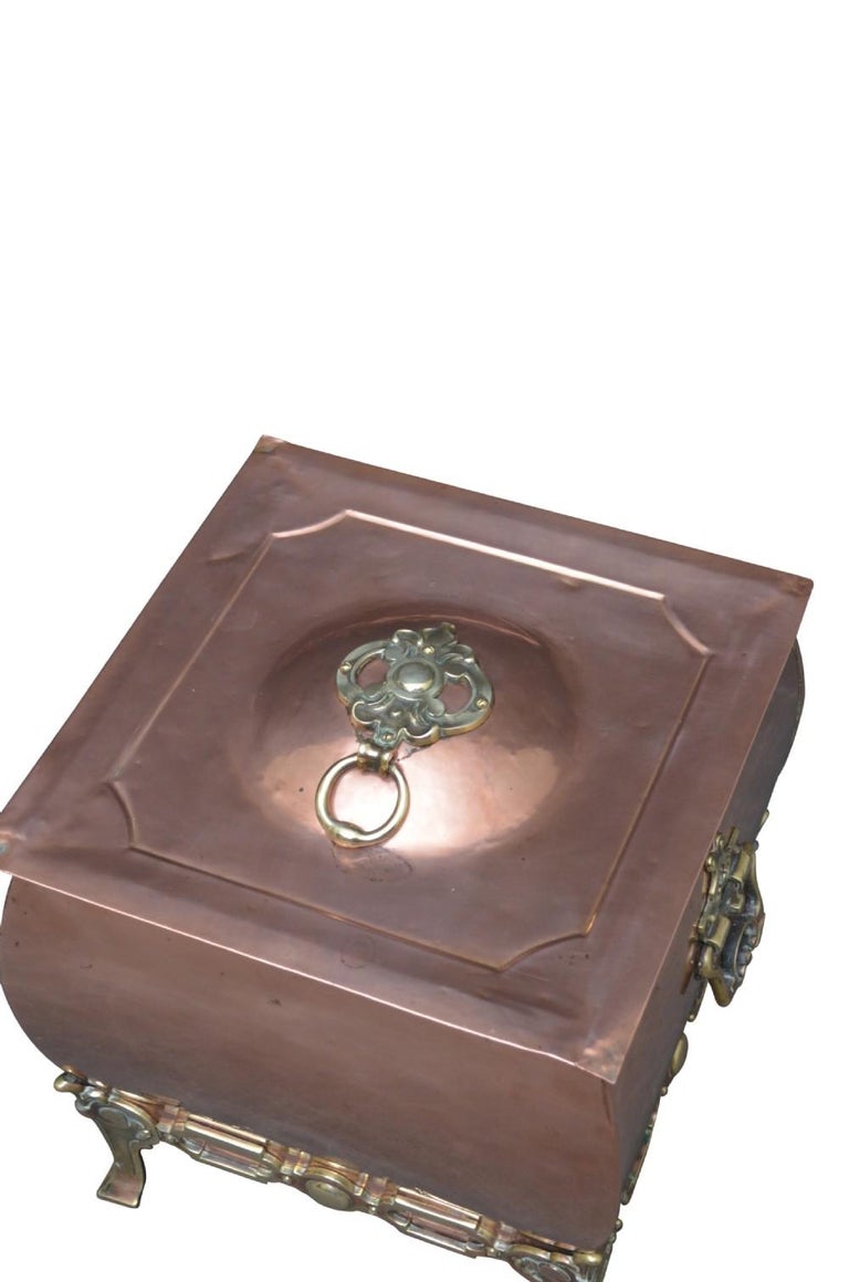 Stylish late Victorian copper coal scuttle with original liner and brass decoration throughout. This antique coal bin would make a perfect planter. Cleaned, polished and ready to use at home. c1890
Measures: H 14.5