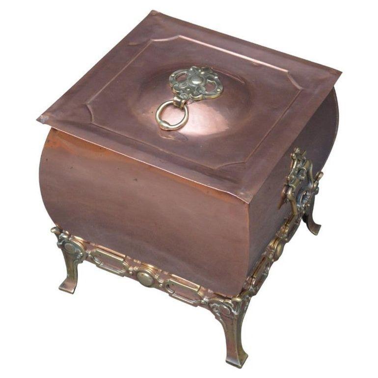k0012 Stylish late Victorian copper coal scuttle with original liner and brass decoration throughout. This antique coal bin would make a perfect planter. Cleaned, polished and ready to use at home. c1890
Measures: H 14.5