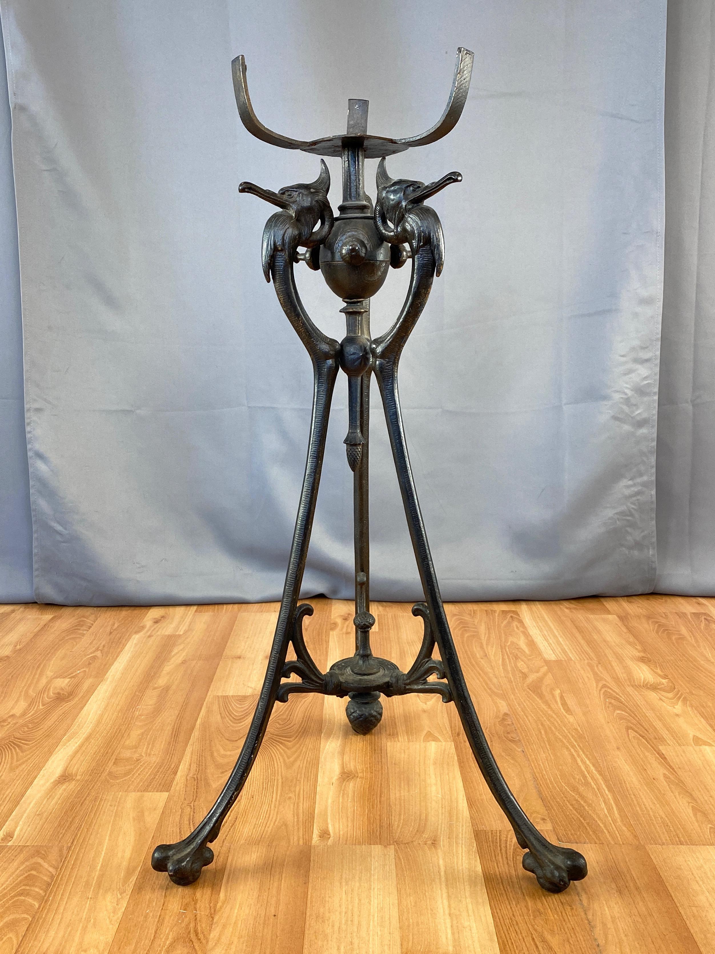 An artfully sculpted and striking circa 1890 late Victorian era cormorant-motif tall cast iron plant stand.

Distinguished by a handsome trio of proudly presenting birds with prominent plumage that appear to represent double-crested or great