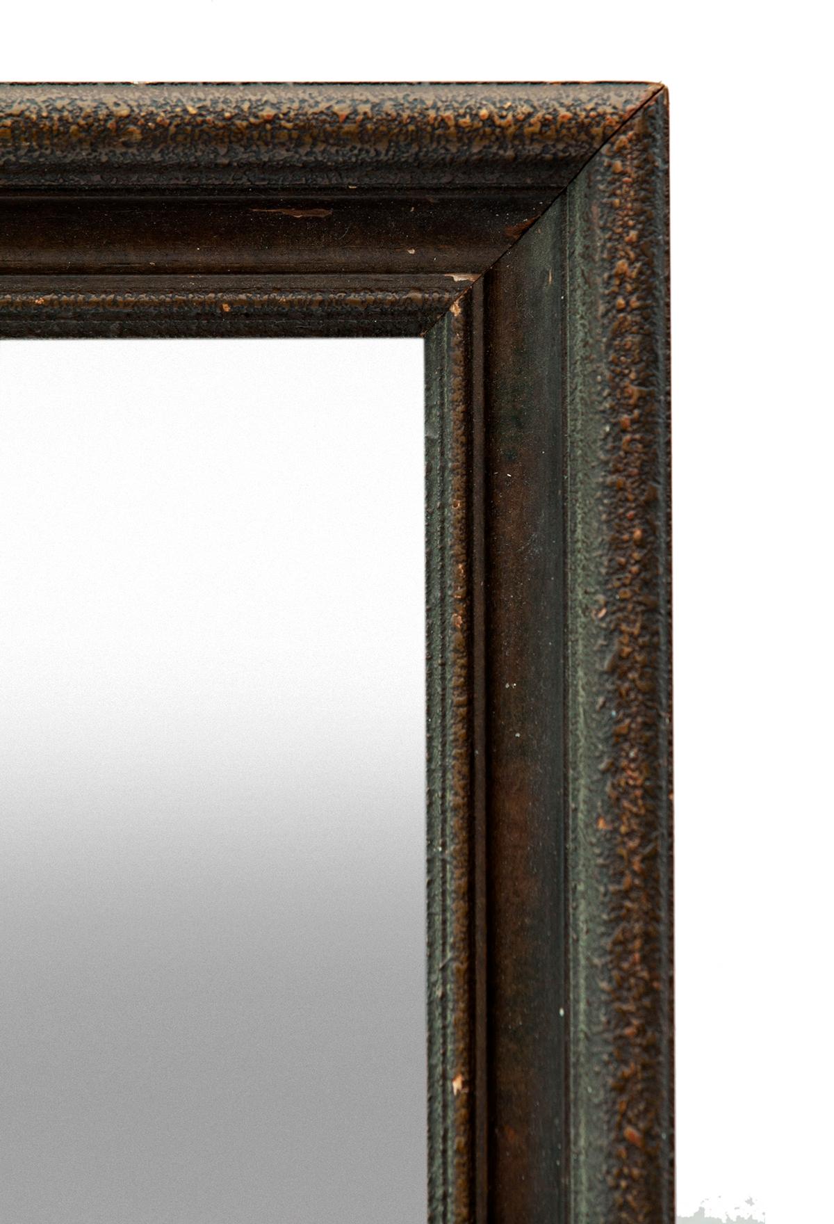 A timeless piece.
Original aged bronze finish on this handcrafted hardwood & dark gesso finished accent mirror.