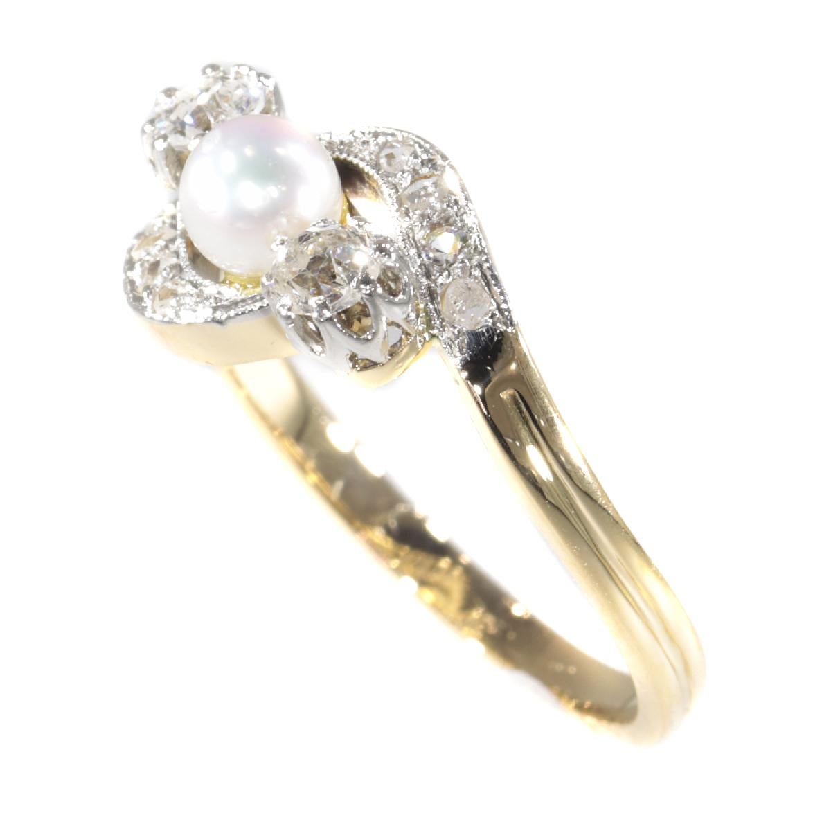 Women's Late Victorian Diamond and Pearl Cross Over Engagement Ring, 1900s For Sale