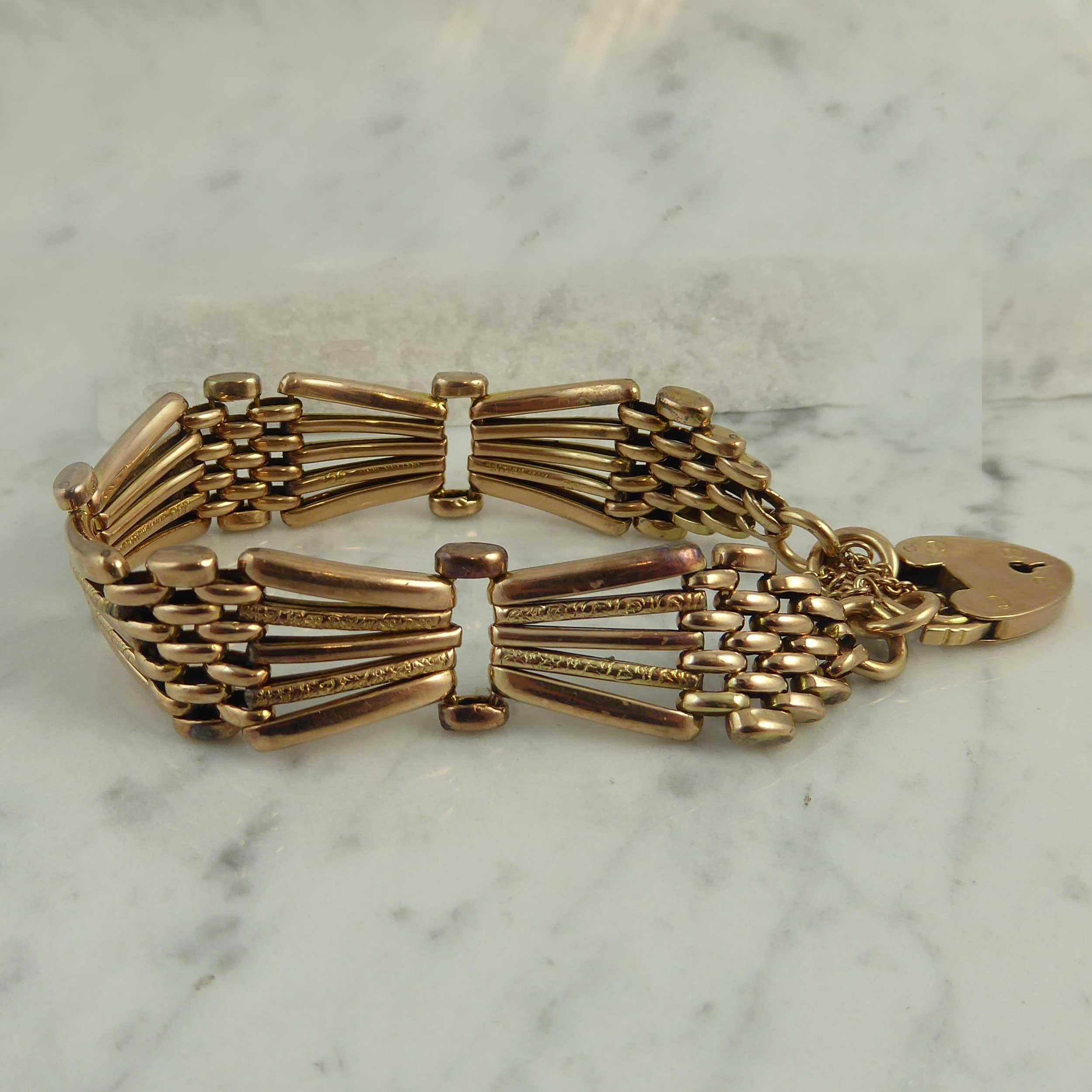 A super example of the popular gold gate bracelet.  This fine classic is comprised of three bow-shaped sections in rose gold, each approx. 1.5 inches long x 0.63 inch wide.  The bows are fashioned from five gold bars - three plain polished
