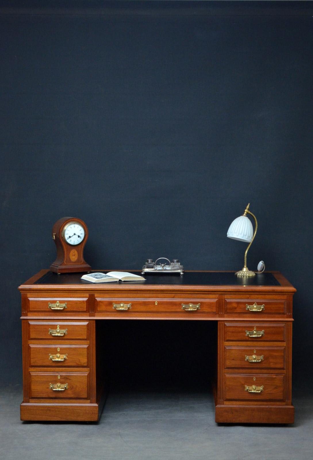 Sn4571, superb quality late Victorian, figured walnut pedestal desk, having black tooled leather to the top above 3 fielded drawers and 3 graduated mahogany lined drawers to each pedestal, all fitted with original brass handles, all flanked by