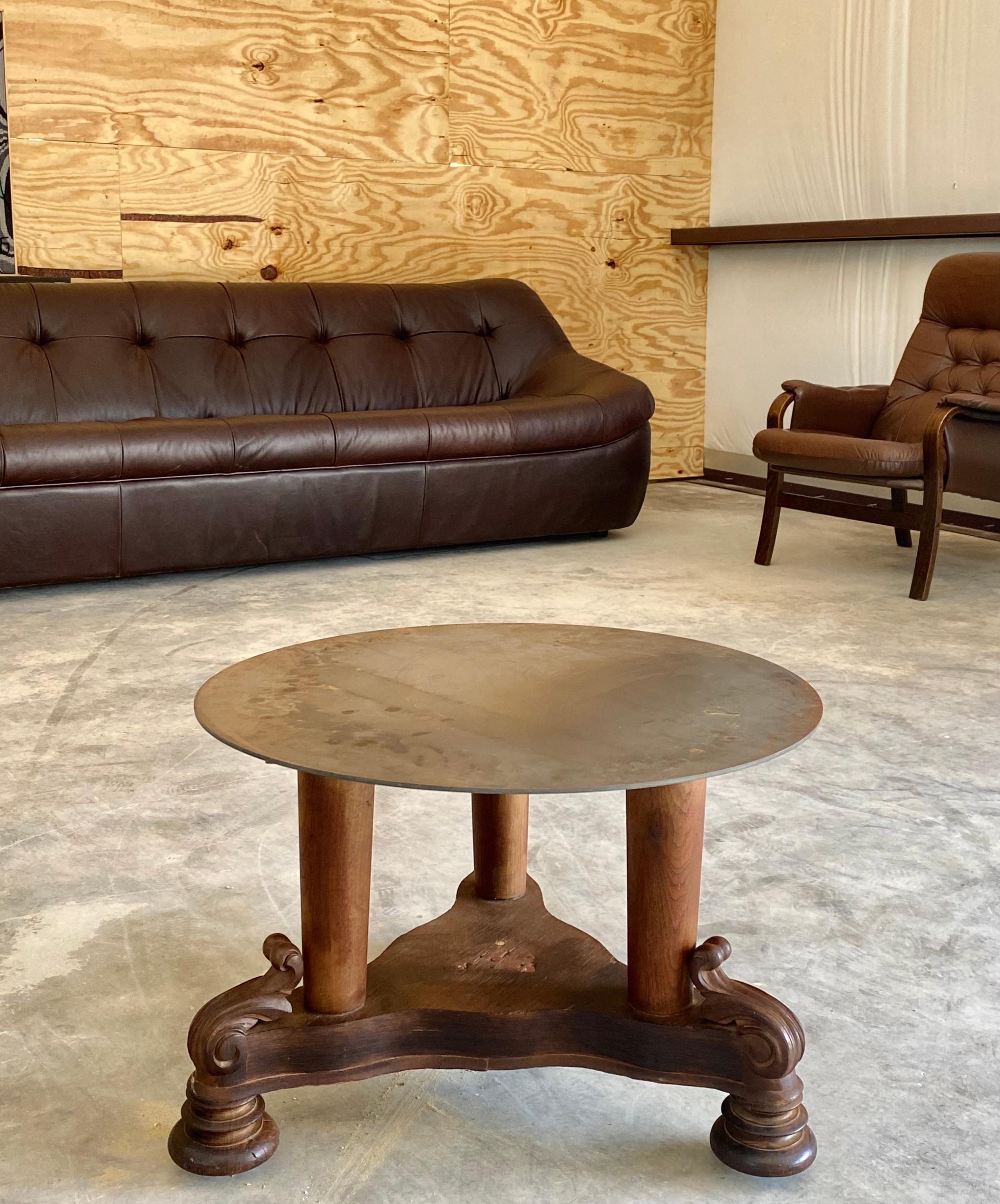 Antique walnut cocktail table or generously scaled side table, dating to the late 1800s. The base is fully original and beautifully preserved, with finely turned legs and carved details resting on brass casters, all exhibiting a rich natural patina.